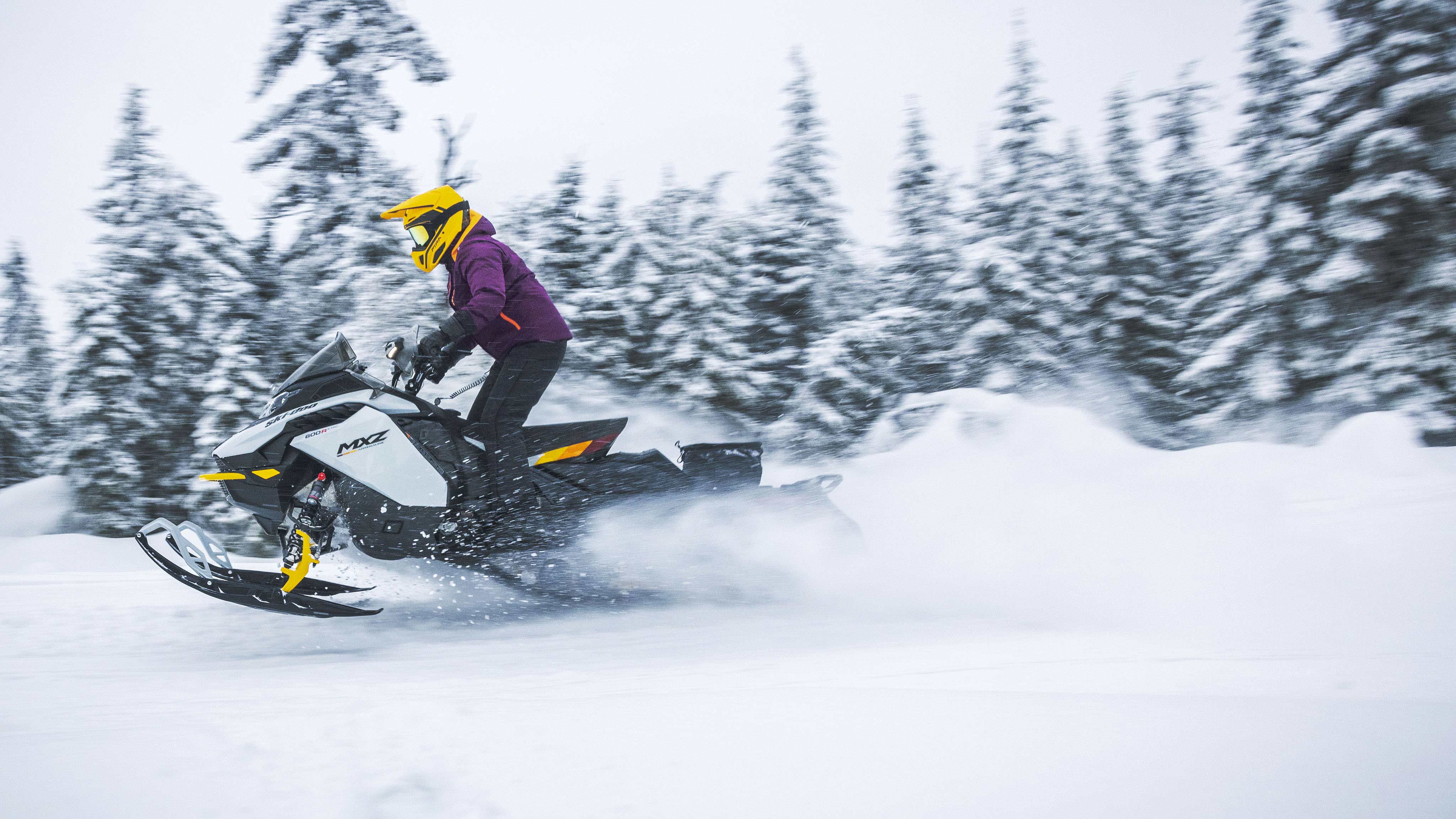 Women driving a Ski-Doo MXZ