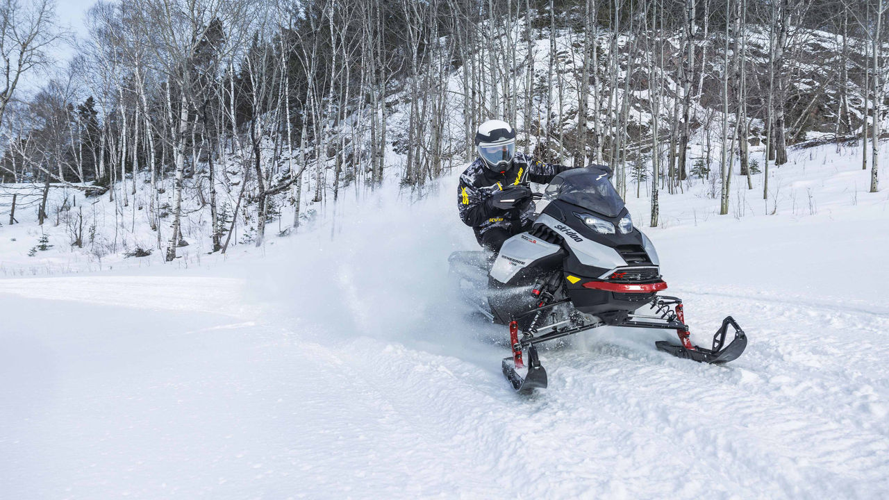 Man riding a Renegade X-RS snowmobile