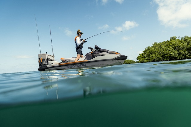 Woman fishing from a 2027 Sea-Doo Fish Pro Trophy