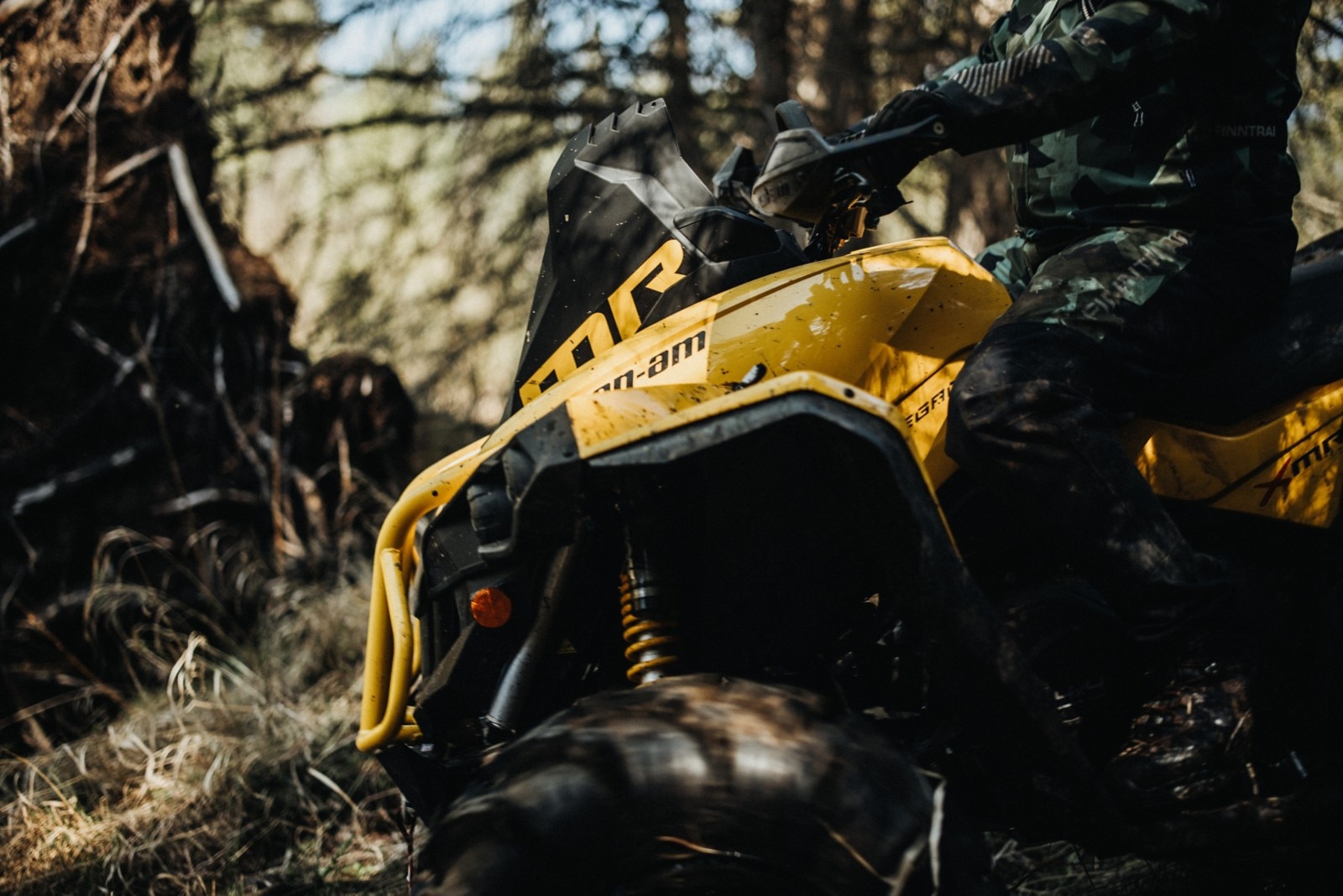Body shot of rider on Can-Am vehicle