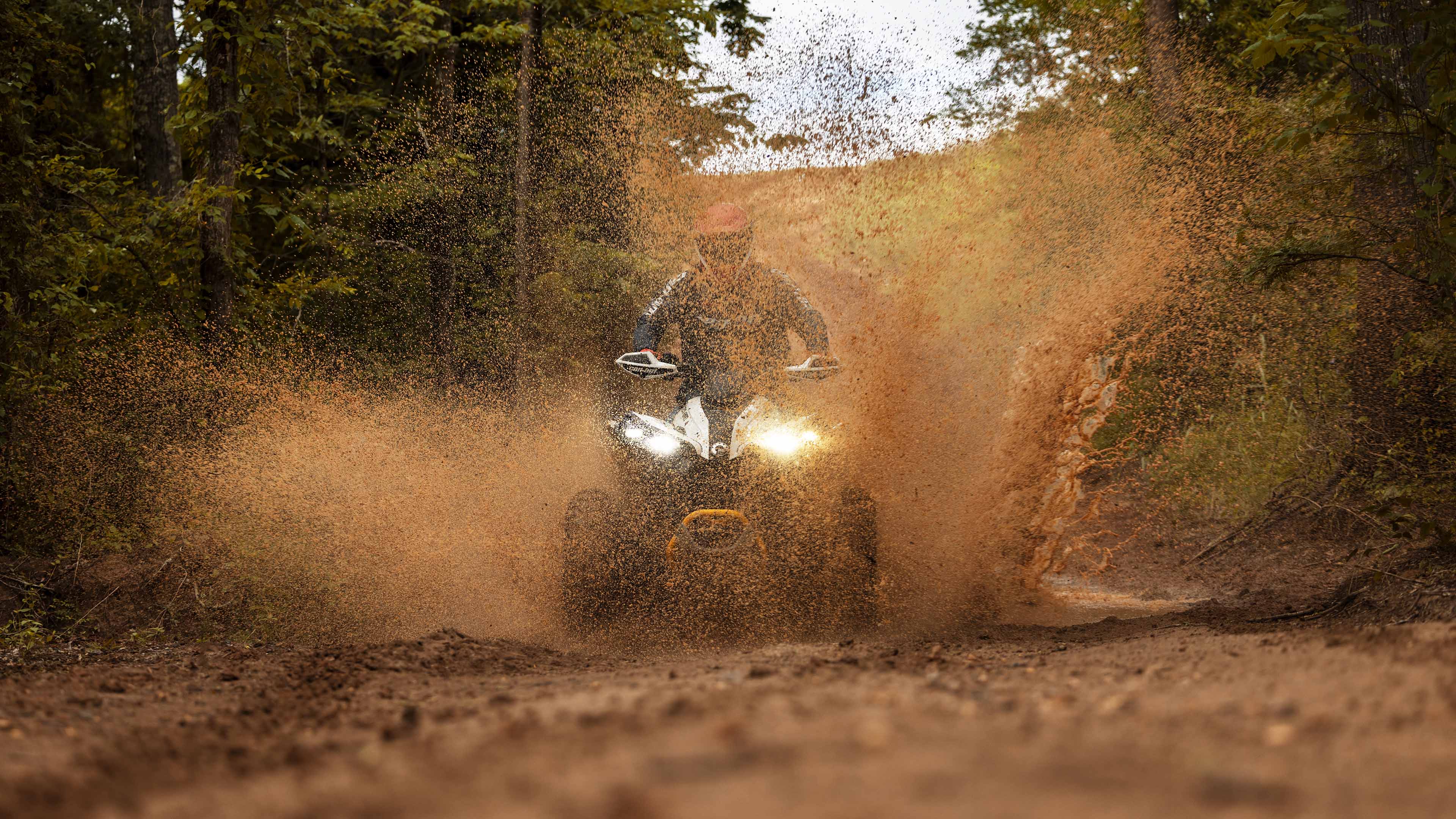 A Can-Am Renegade kicking up mud