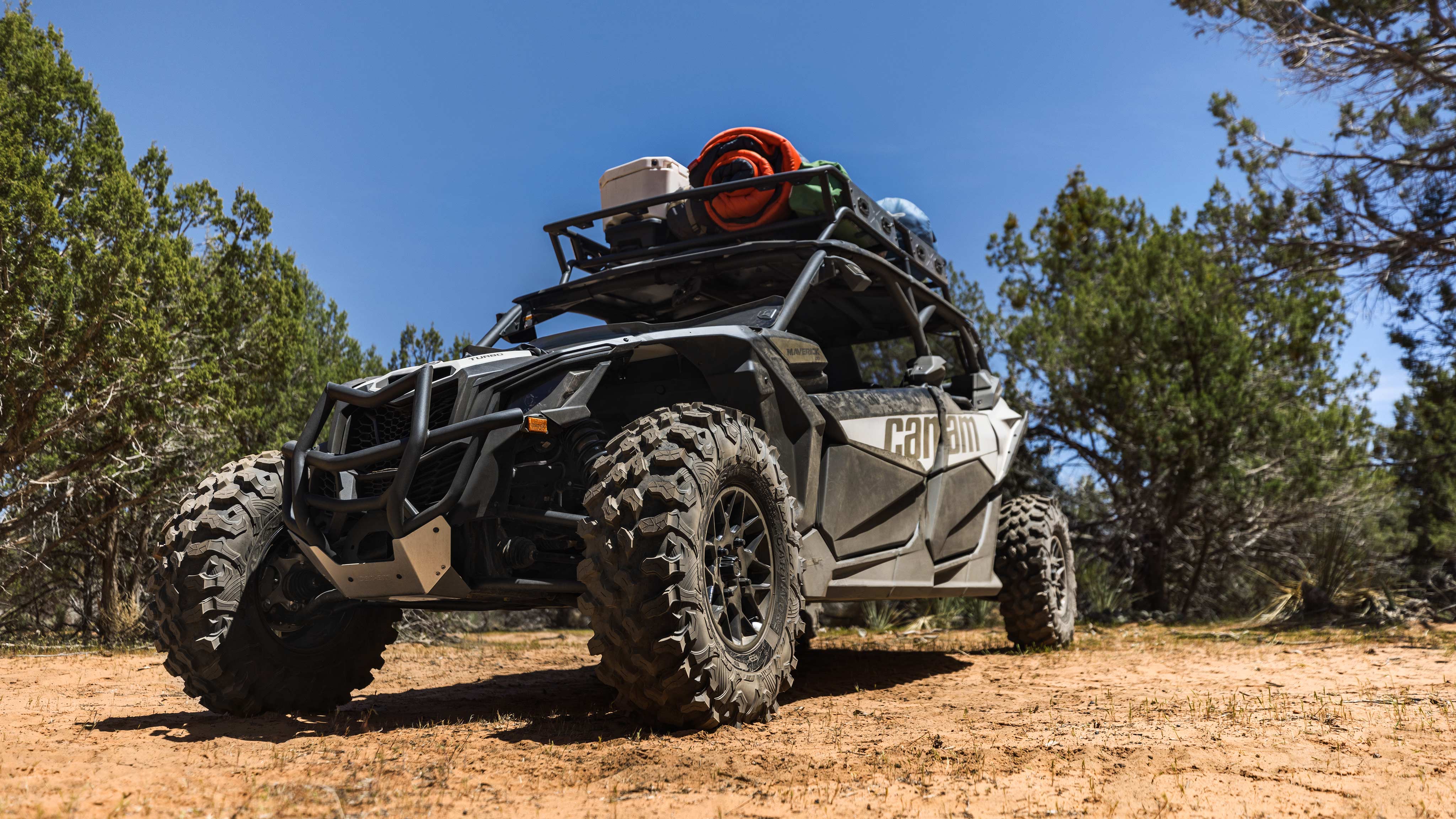 Man driving a Can-Am Maverick in the sand