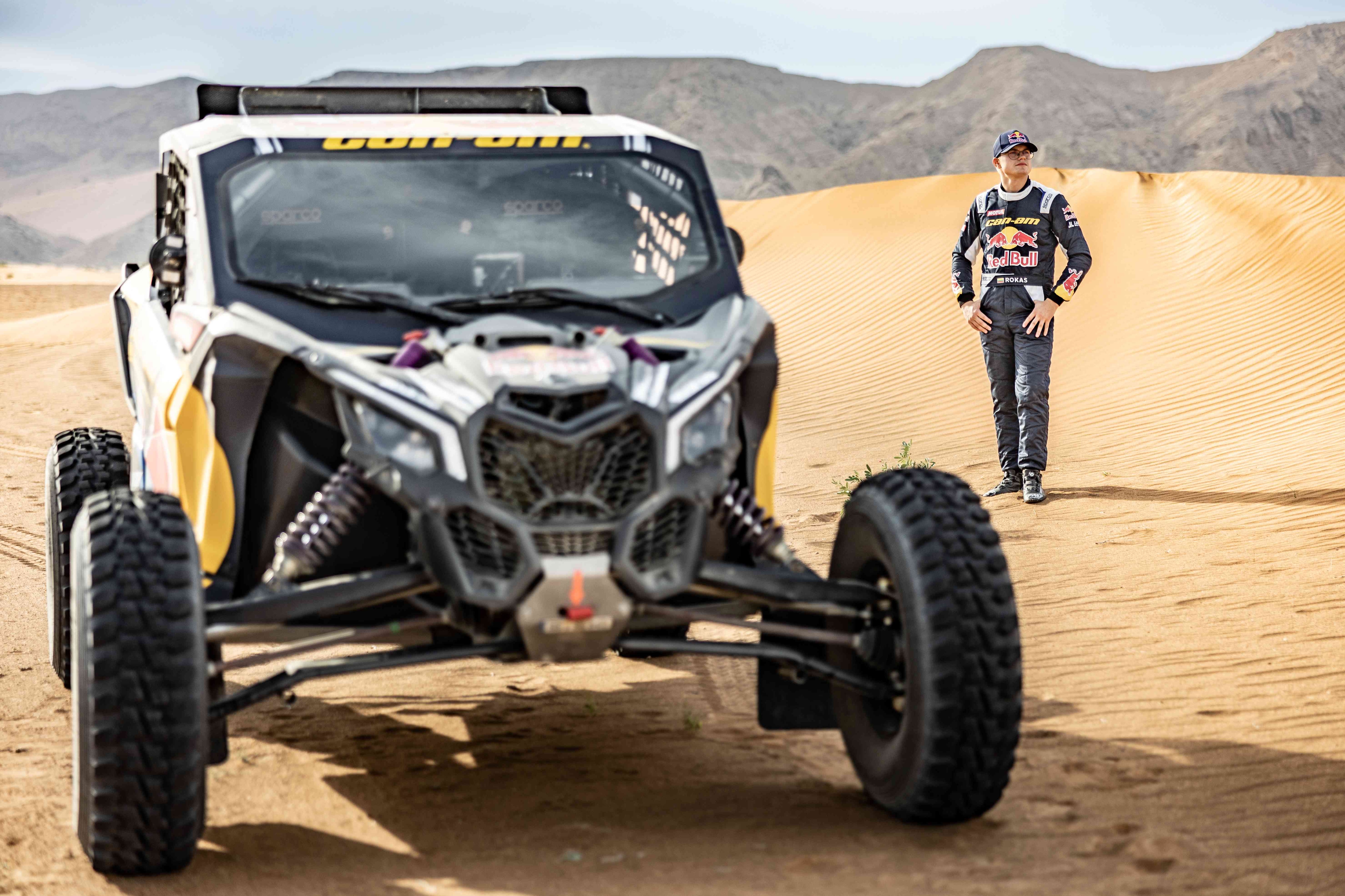 Rokas Baciuska behind his Maverick vehicle during Dakar 2023