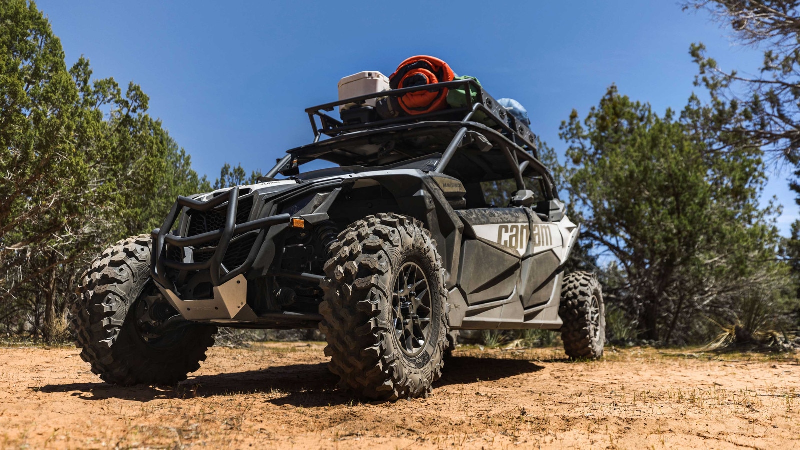 Man driving a Can-Am Maverick in the sand