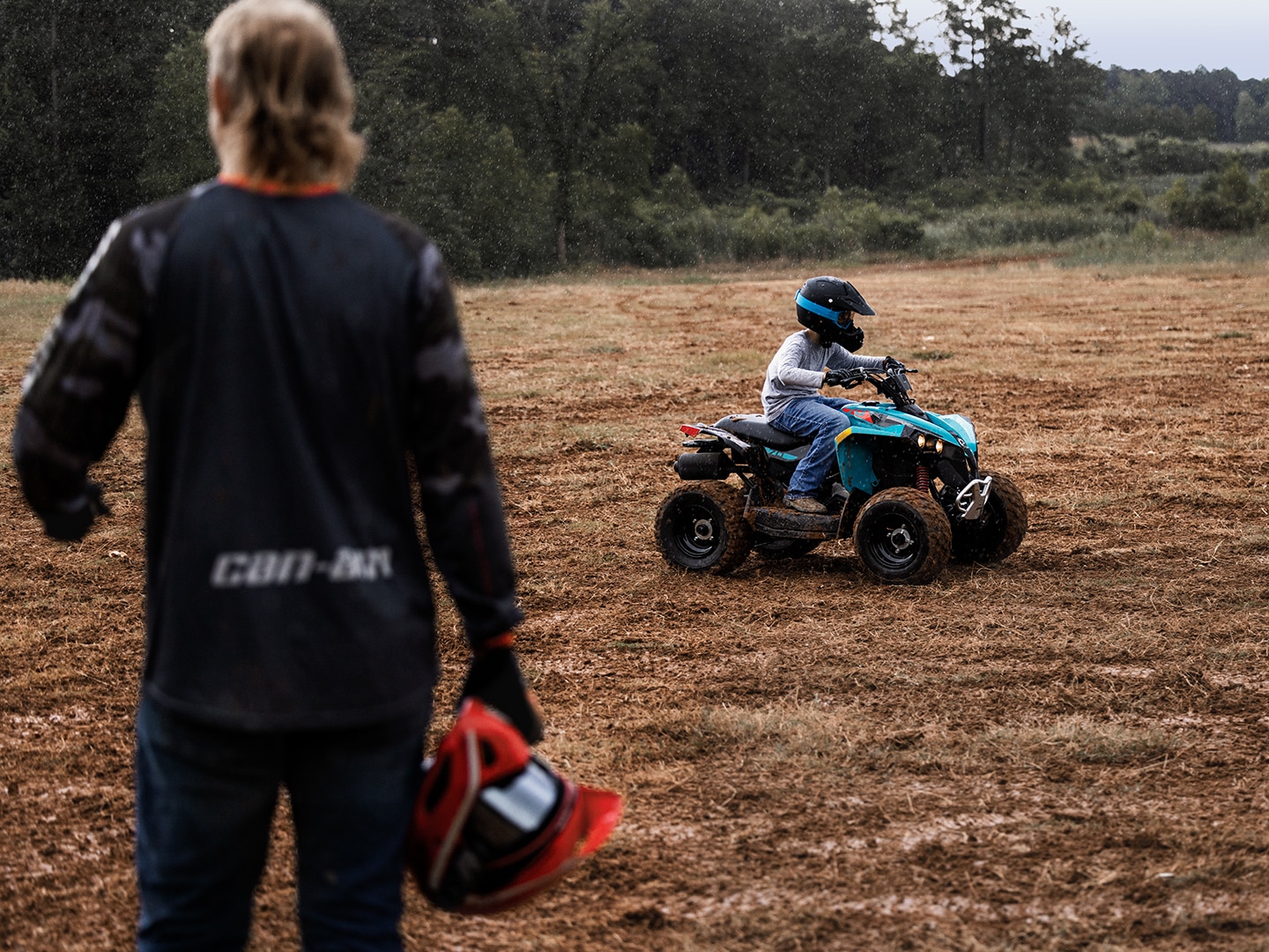 Can-Am rider looking at a younger one