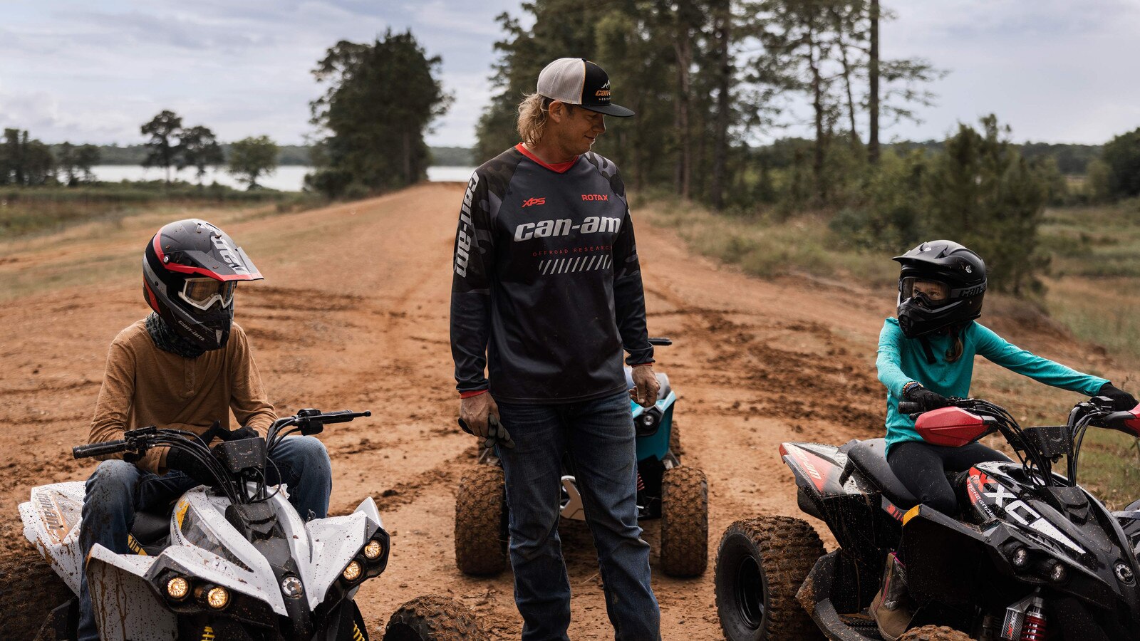 Dustin Jones talks to two young ATV riders