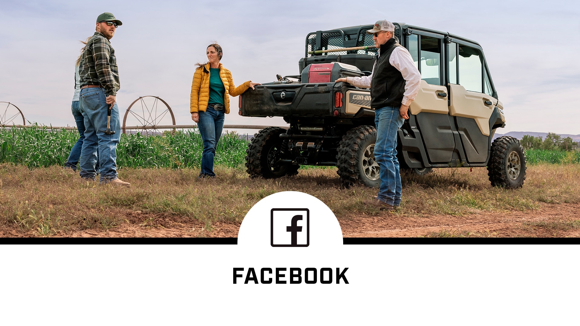 People stand around Can-Am Defender MAX and a Facebook social media logo