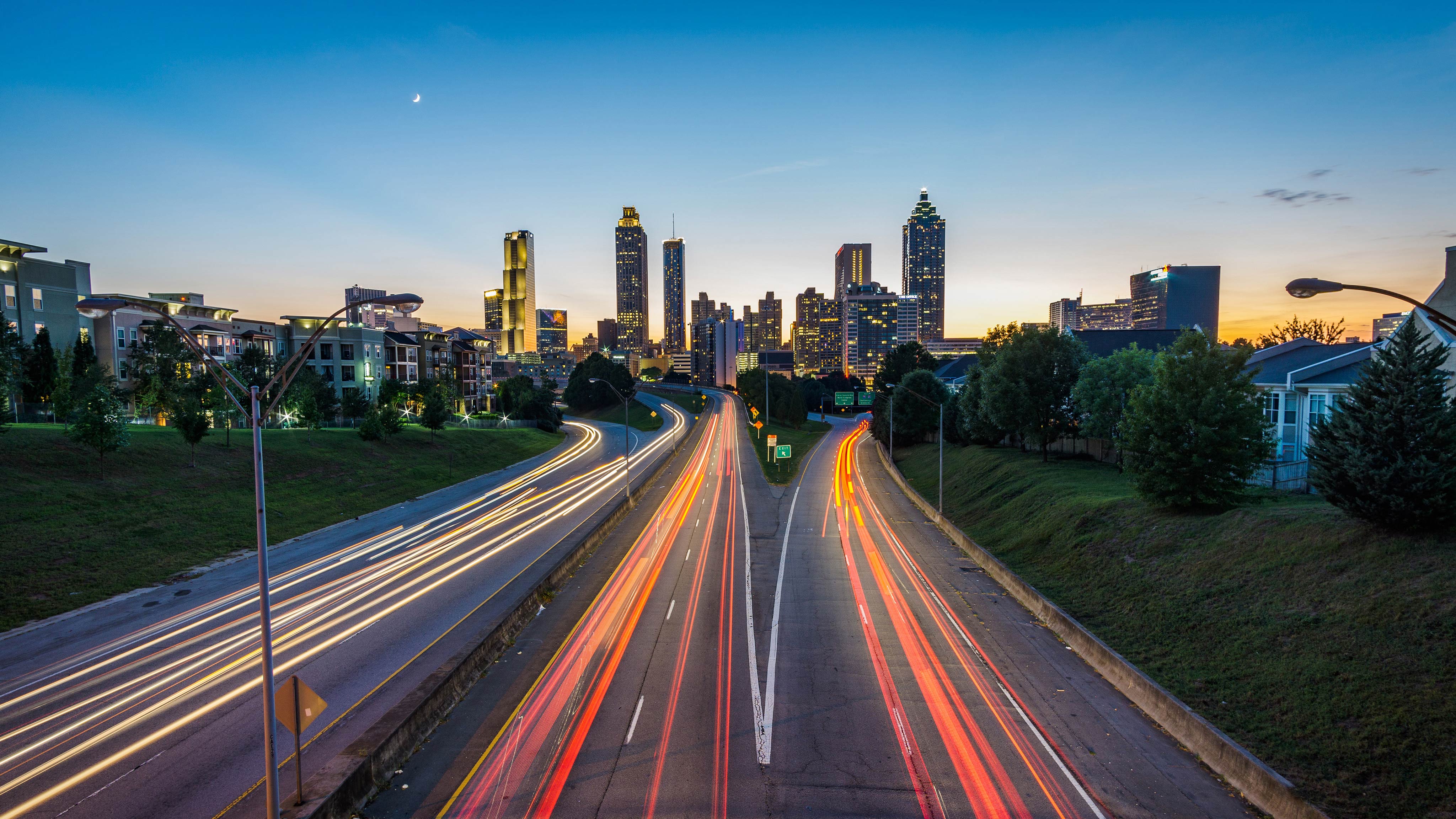Timelapse of cars heading in and out of the city at sunset