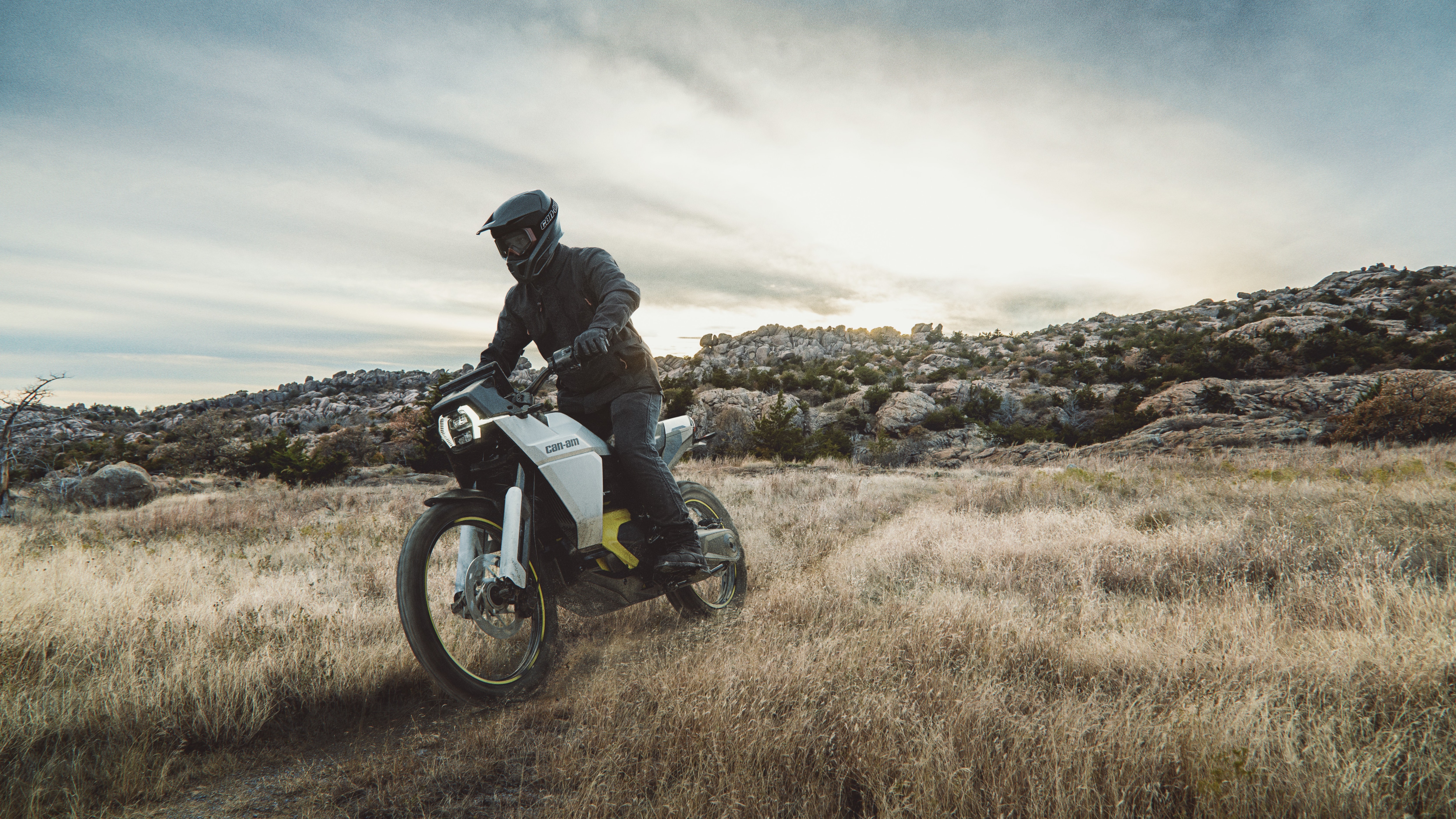 Driver riding a Can-Am Origin in a country trail