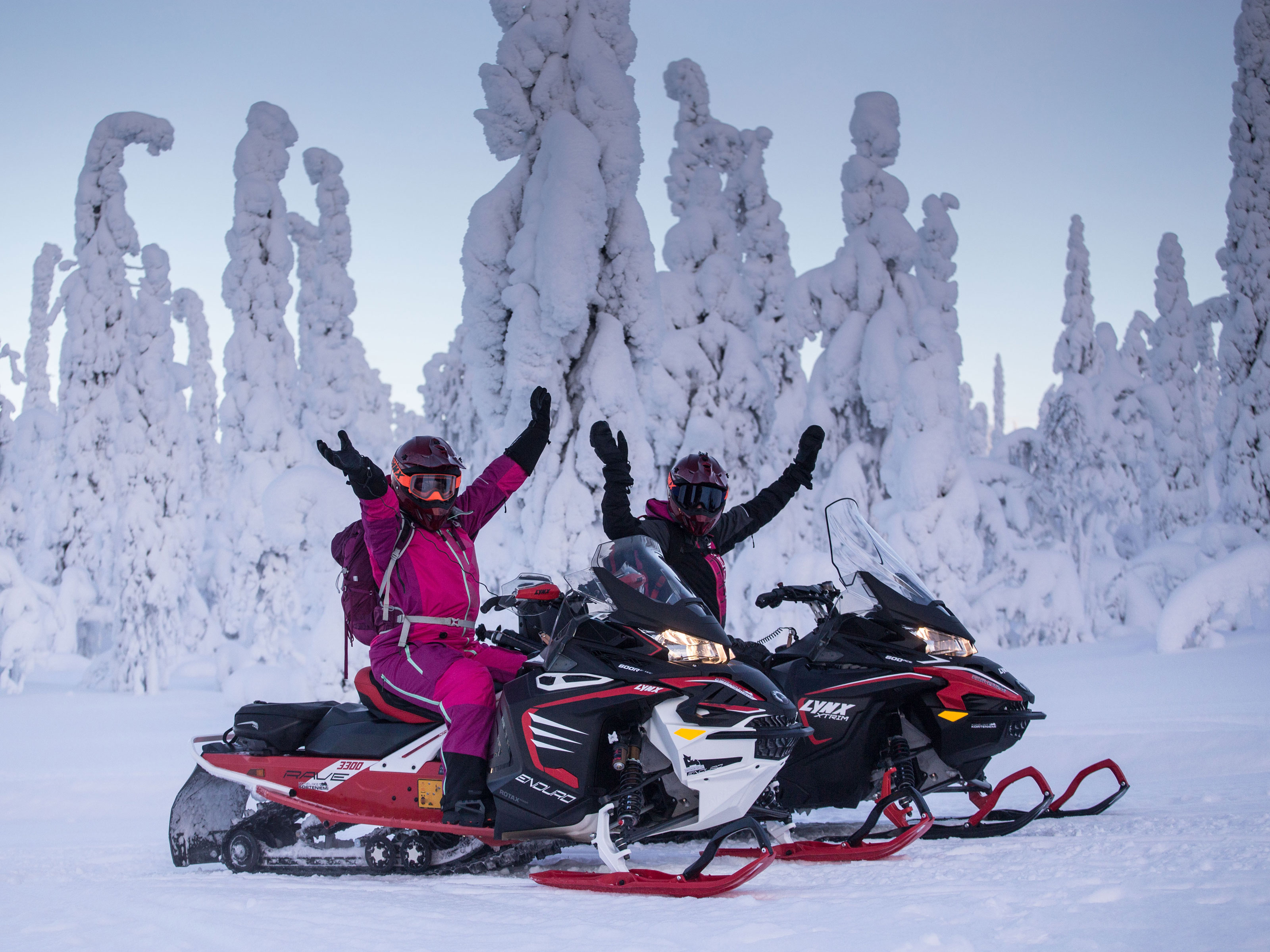 Minttu and Inari handsup on sleds