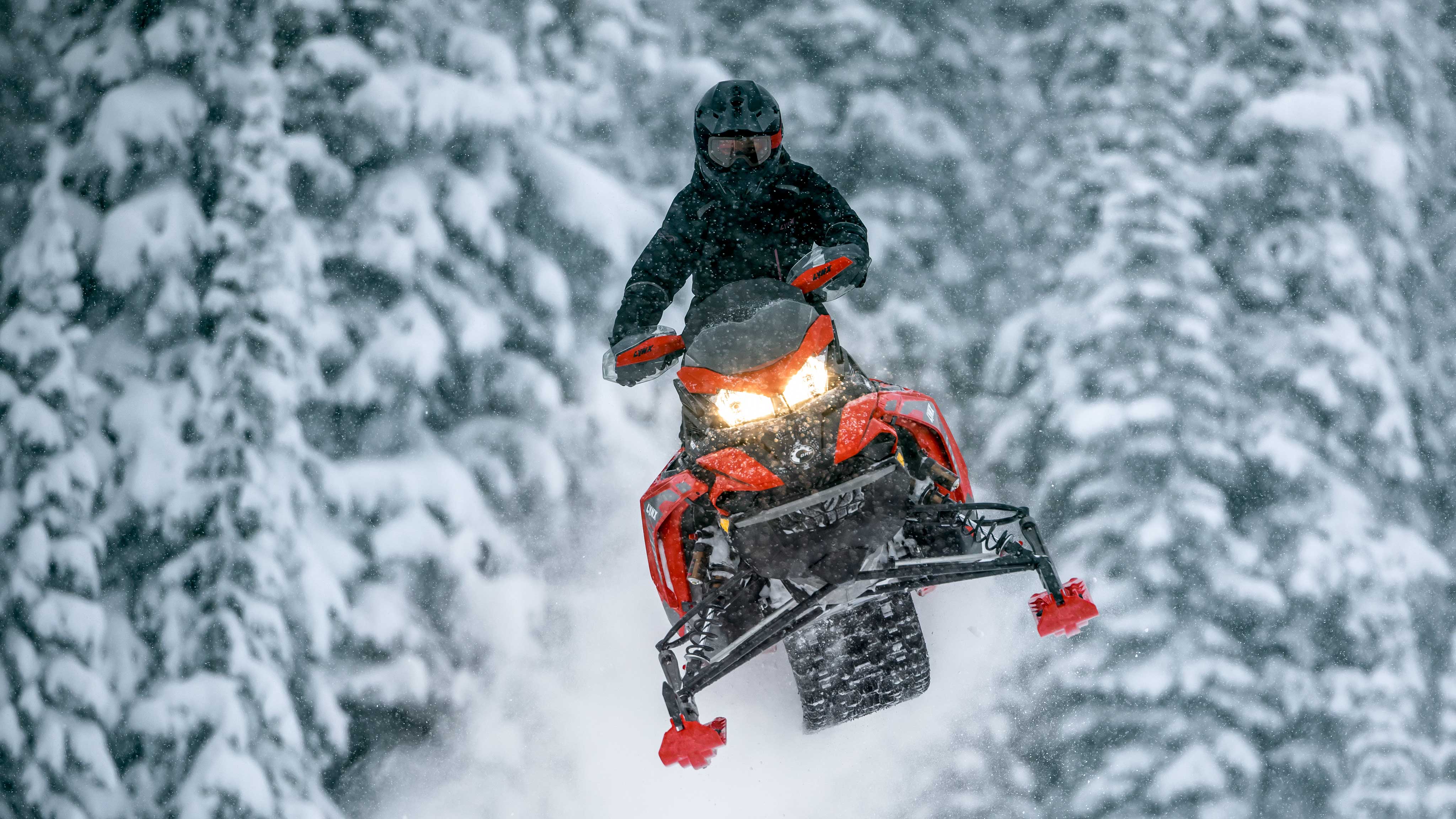 Lynx snowmobile flying mid-air