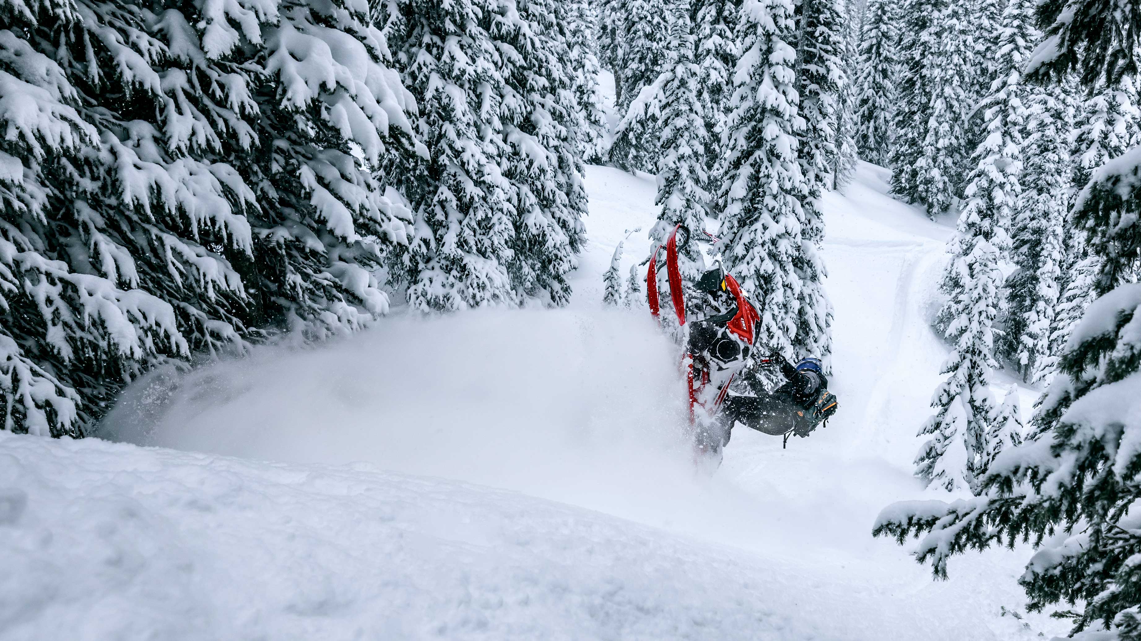 Rider pulling off an air trick with their Lynx snowmobile