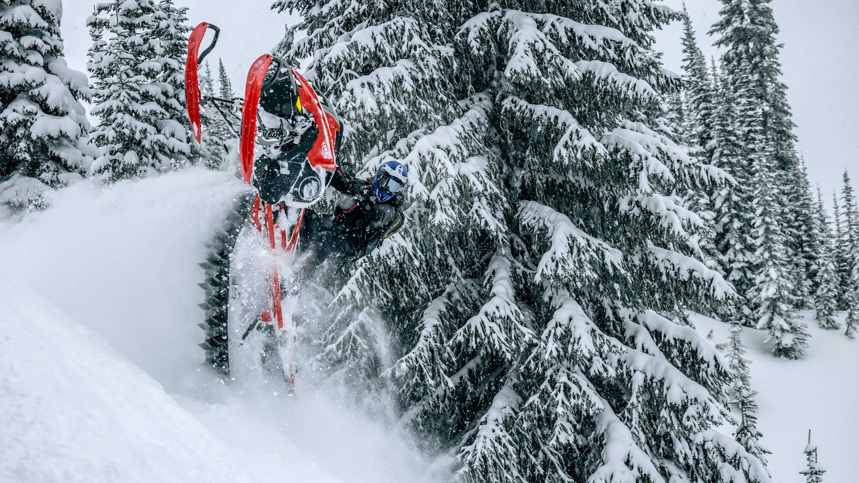 Lynx snowmobile rider in mid-air
