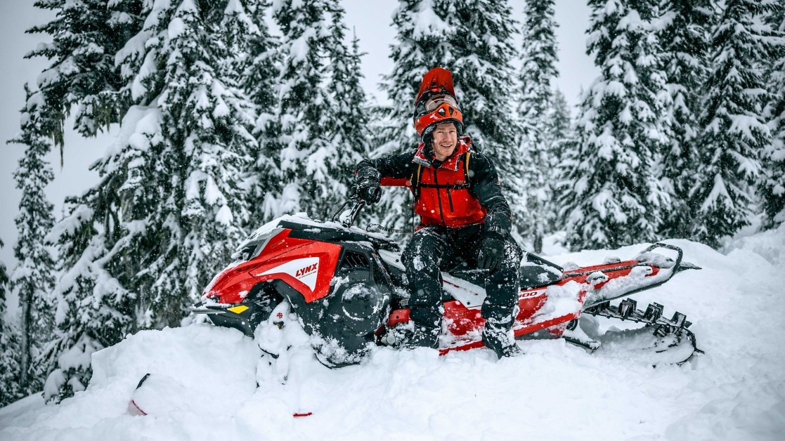 Man riding a Lynx snowmobile