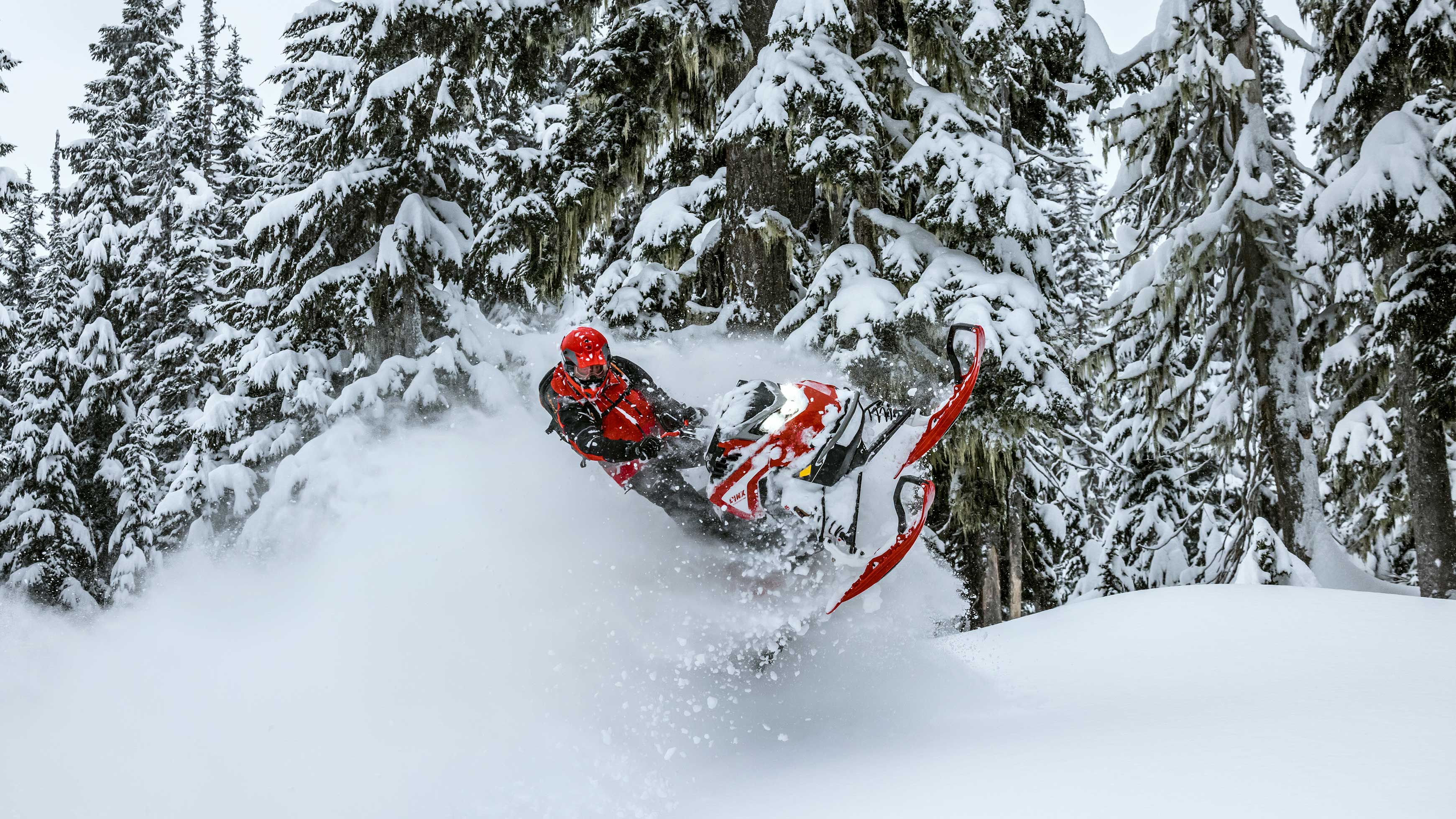 Rider jumping with their Lynx Shredder snowmobile