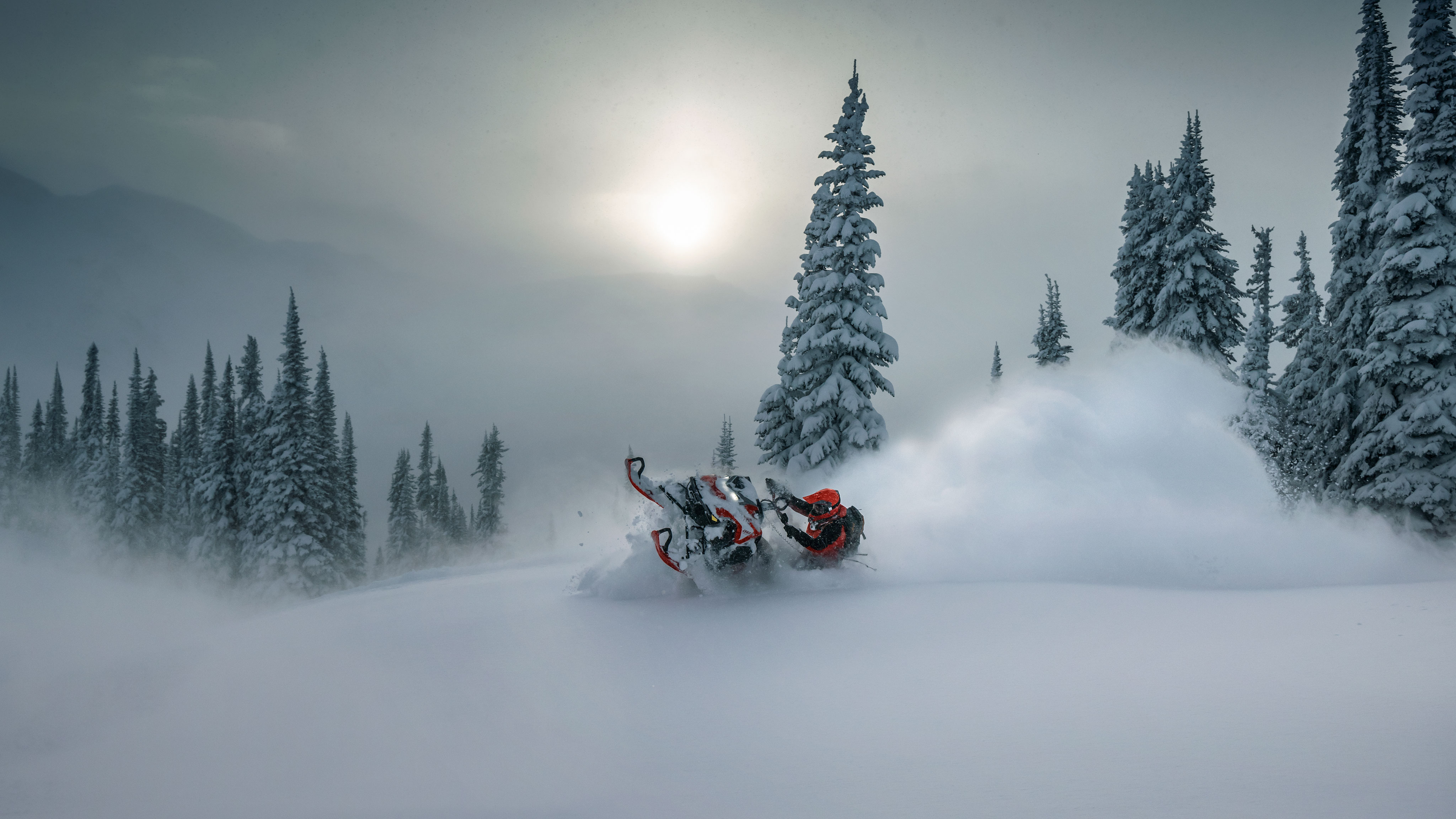 Rider pulling out of deep snow on their 2023 Lynx snowmobile