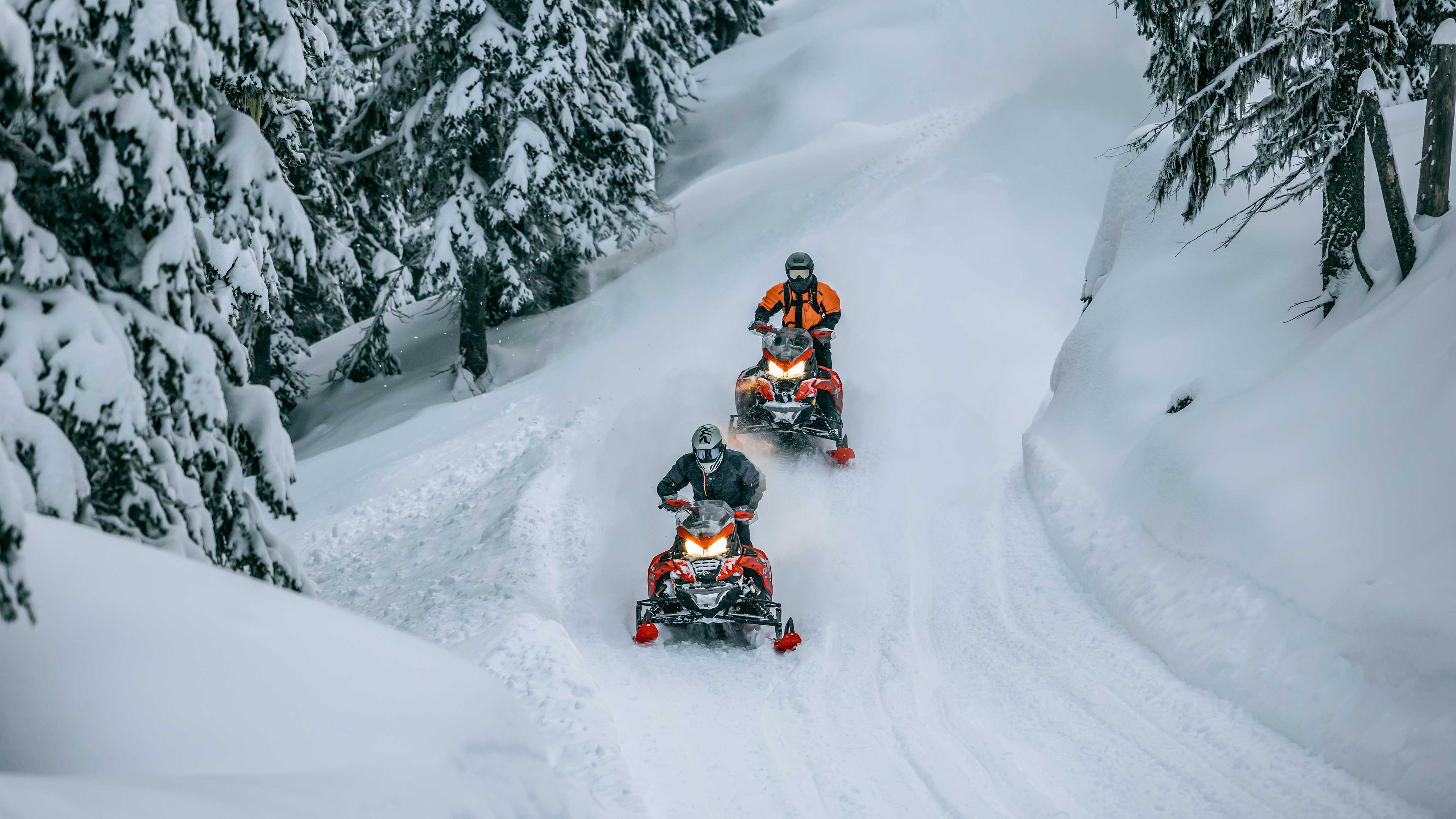 Friends riding around with their 2023 Lynx snowmobile