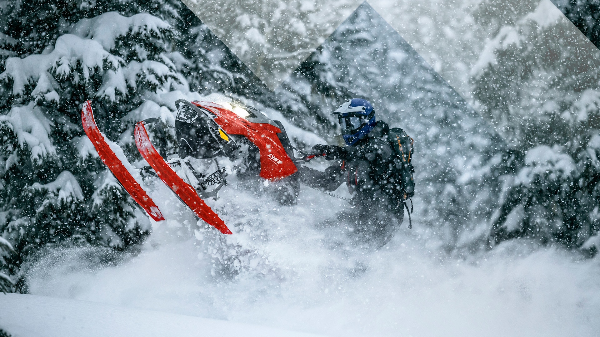 Rider on a Lynx Snowmobile riding out of deep snow