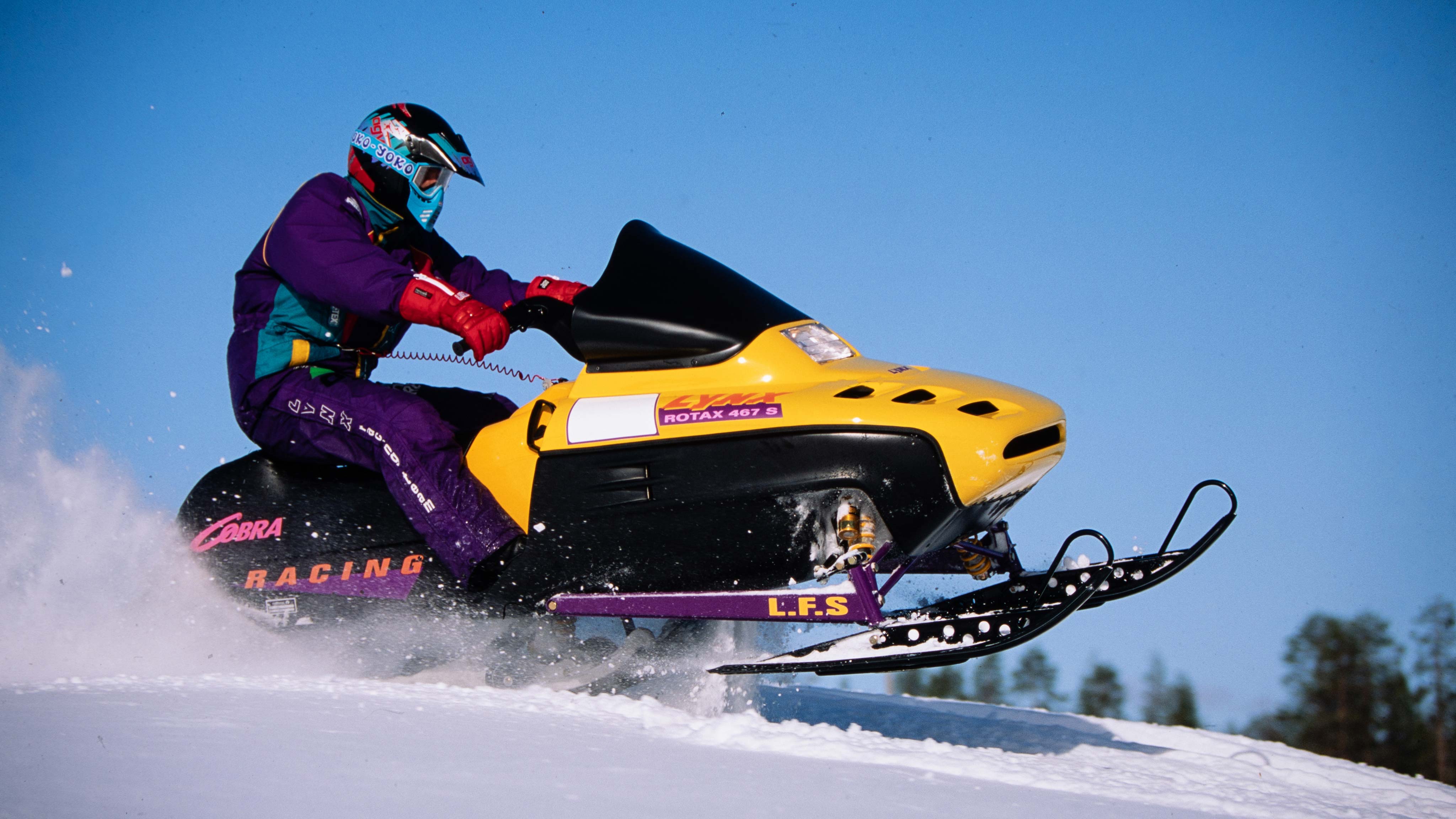 Rider accelerating with Lynx Cobra Racing snowmobile