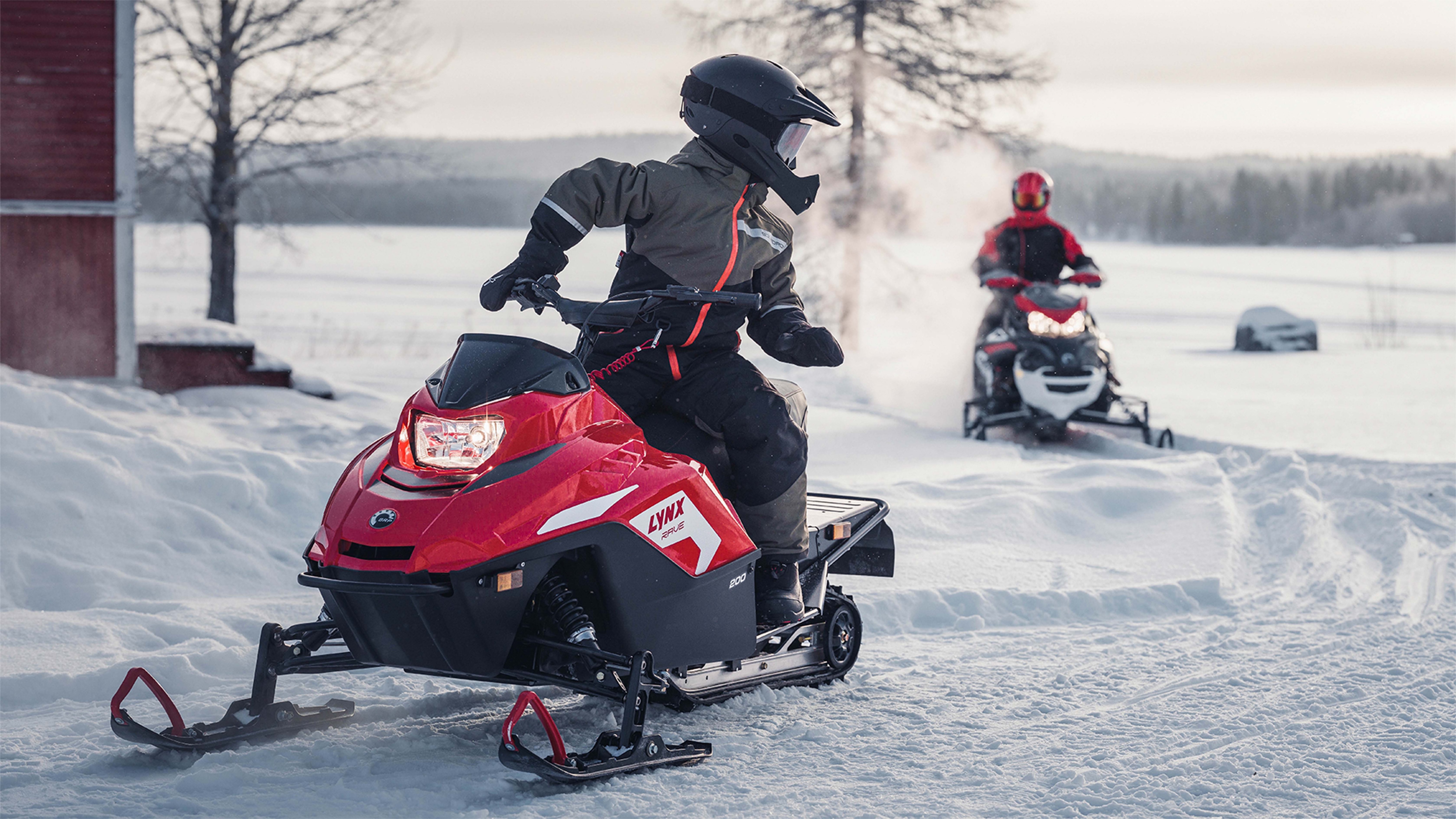 Lynx Rave snowmobile riding on trail