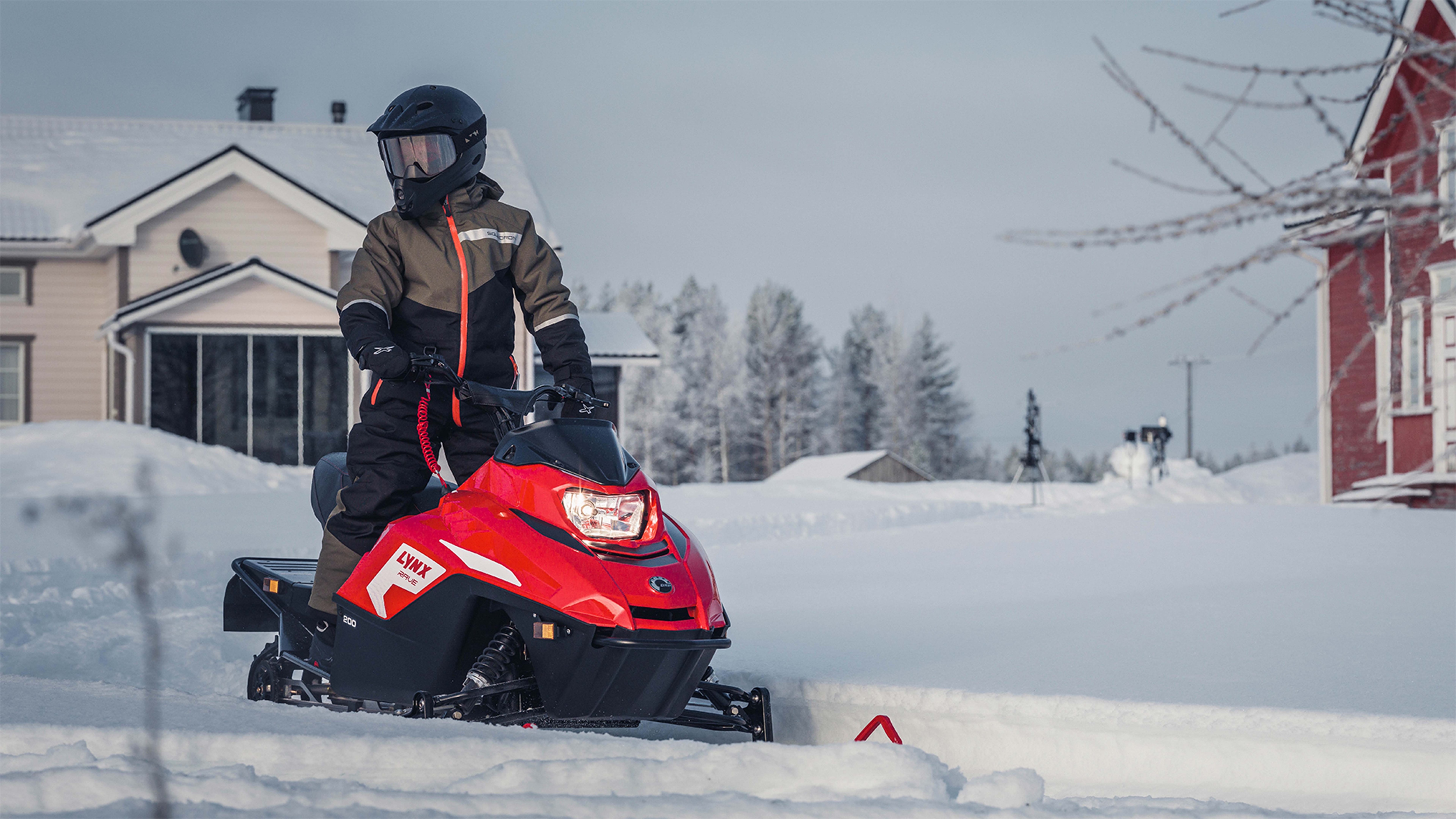 Lynx Rave snowmobile riding on trail