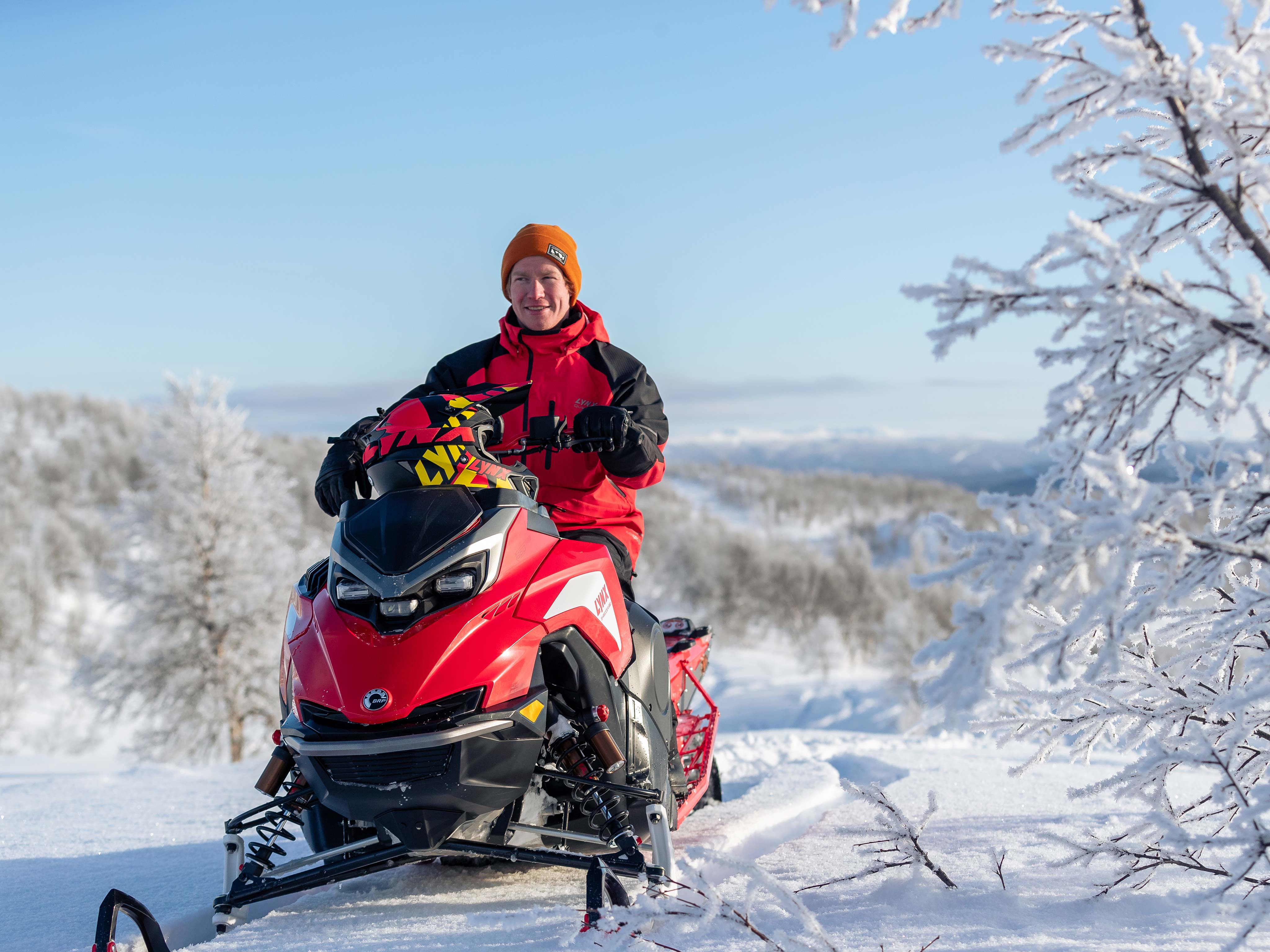 Man riding a Lynx snowmobile