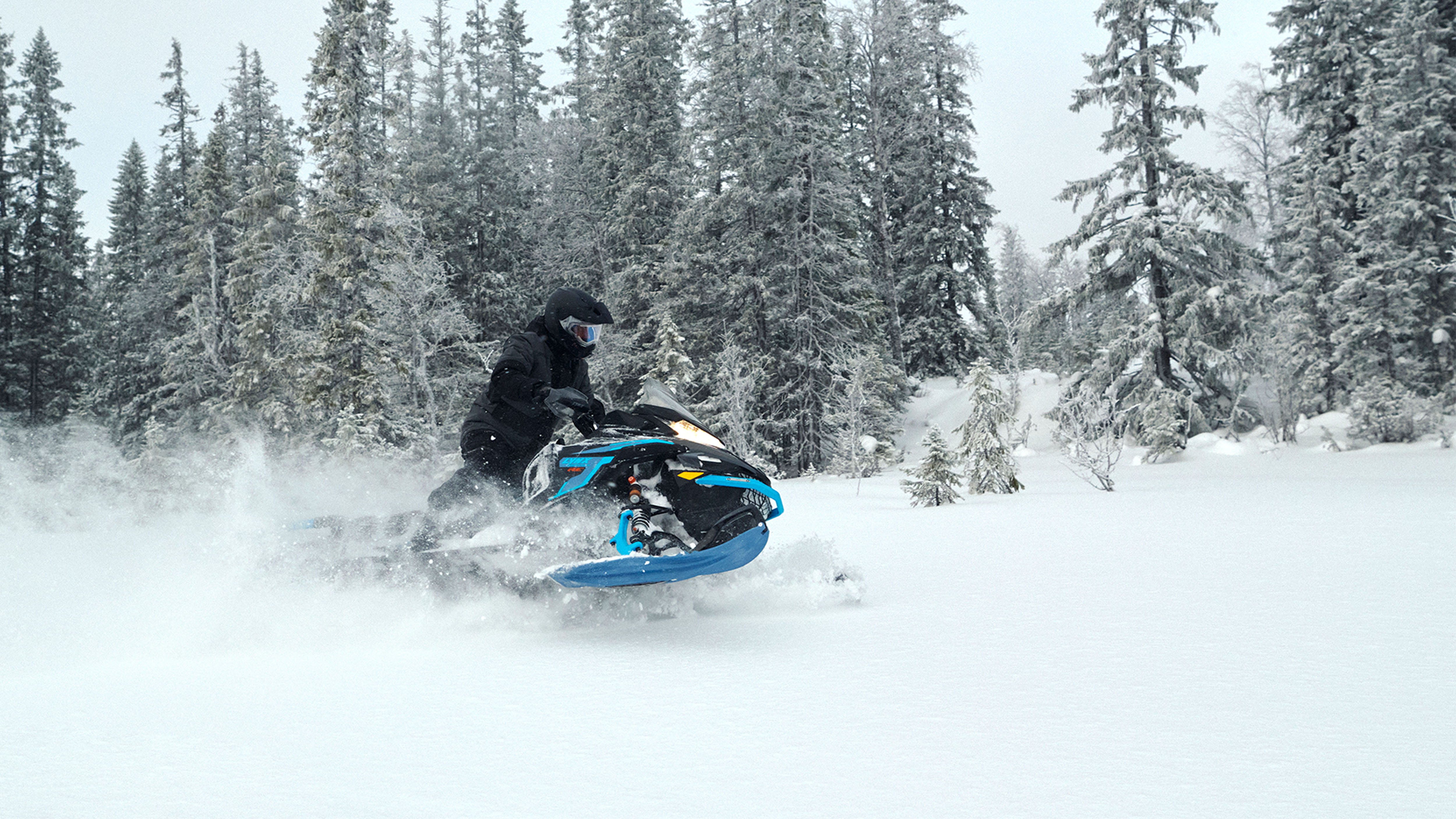 Lynx Commander RE snowmobile riding in deep snow