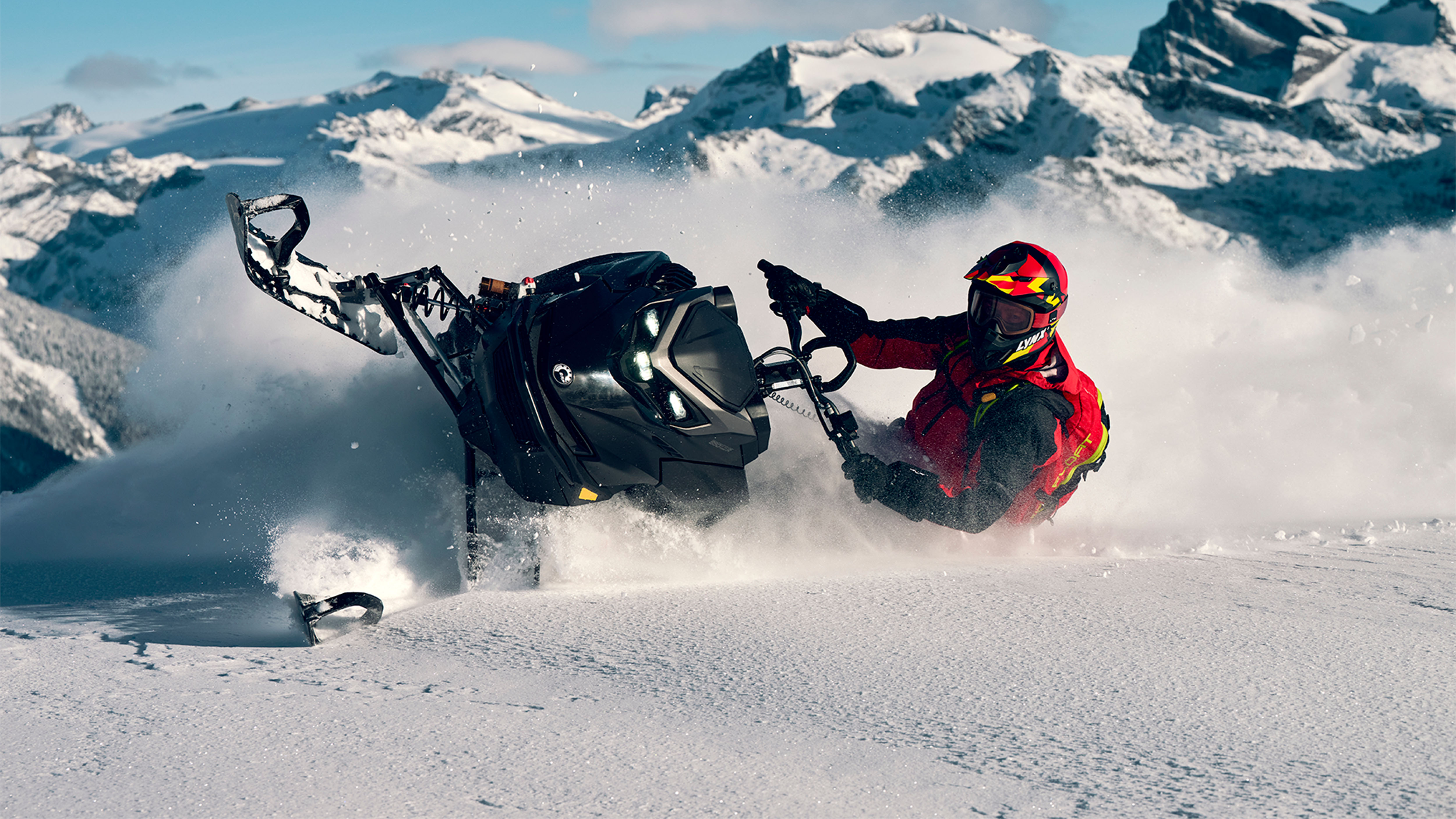 Lynx Shredder RE snowmobile making a tight turn in deep snow