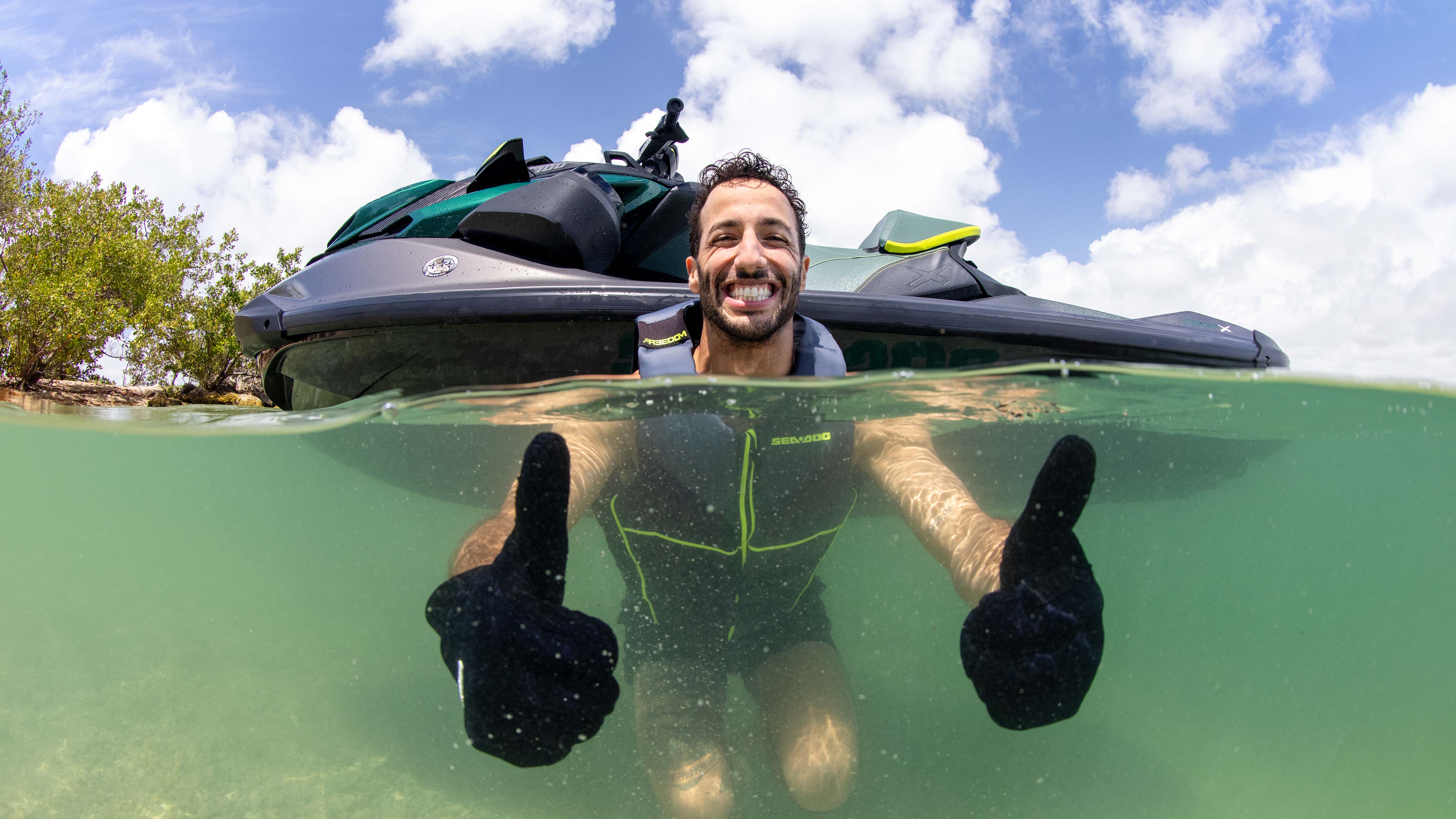 Daniel Ricciardo in the water giving two thumbs up for the new Sea-Doo