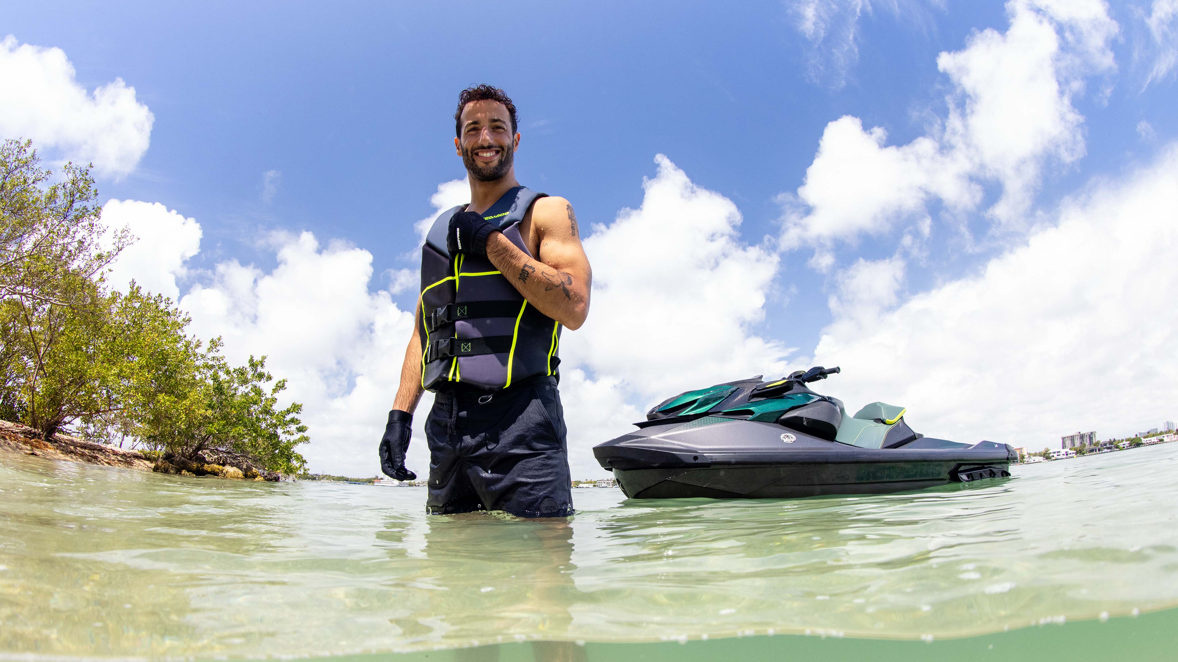 Daniel Ricciardo in the water next to the new exclusive and high performance Sea-Doo personal watercraft