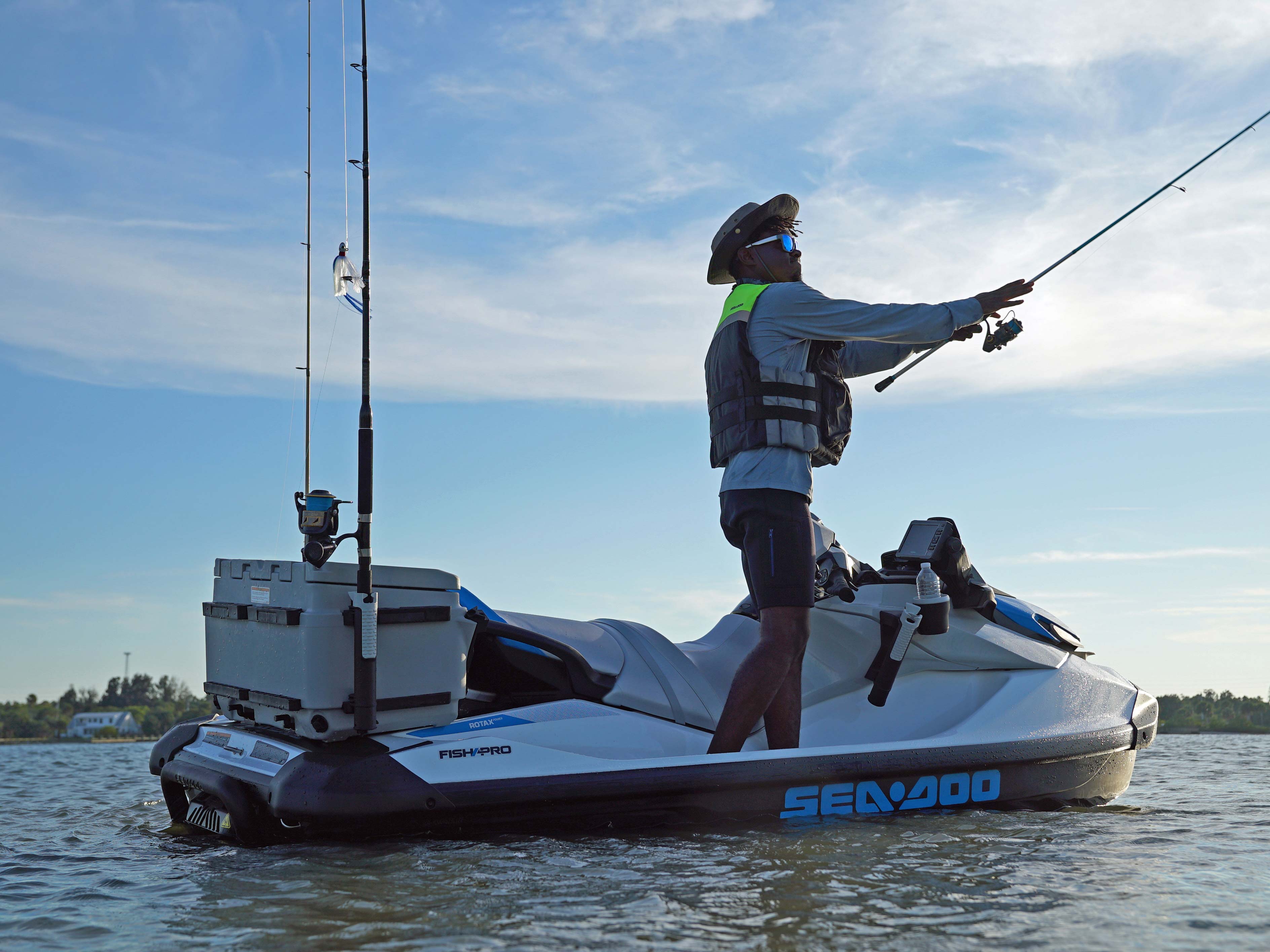 Man standing on the Sea-Doo FishPro Scout while fishing