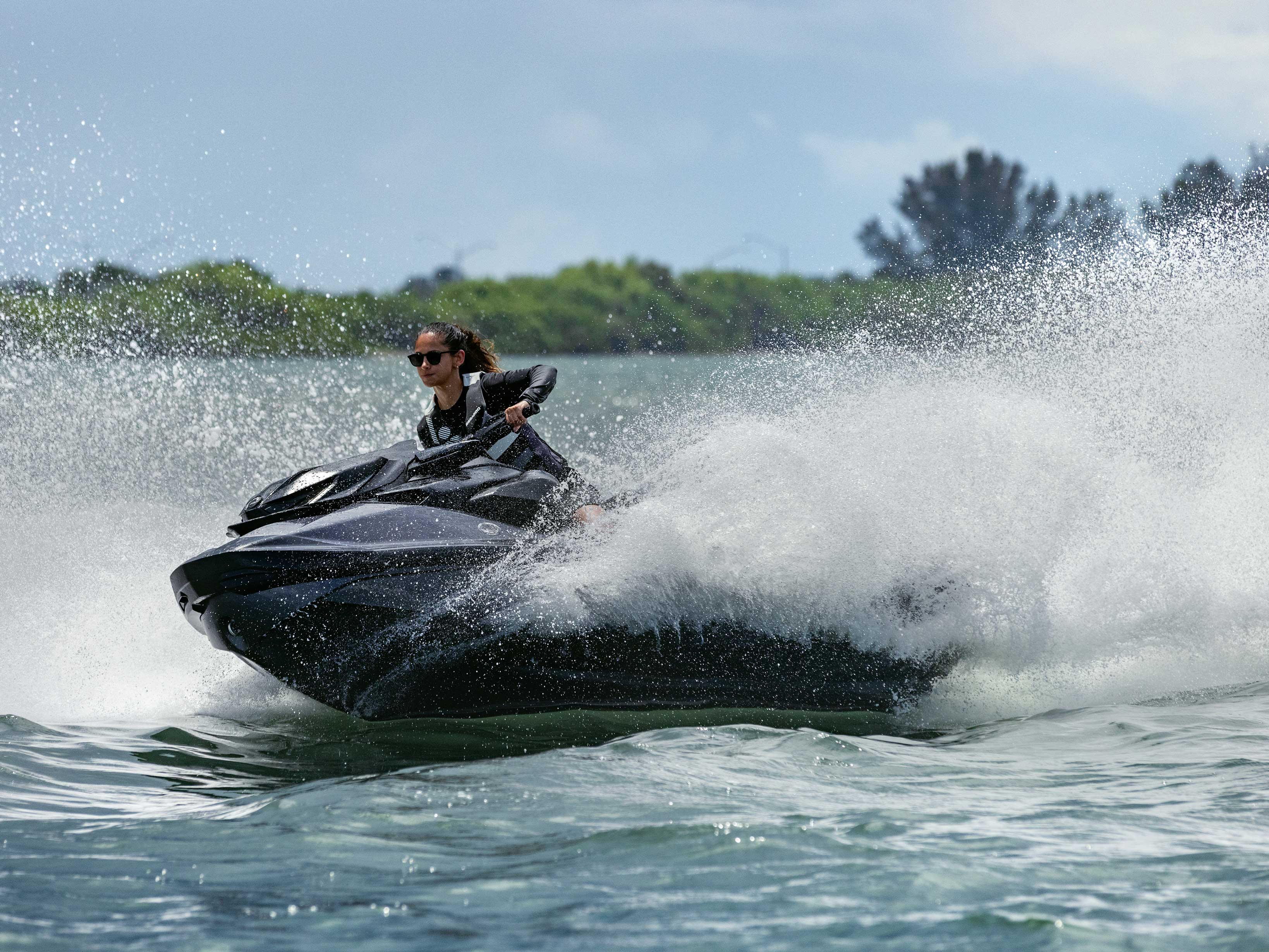 Woman carving water with the 2022 Sea-Doo RXP-X