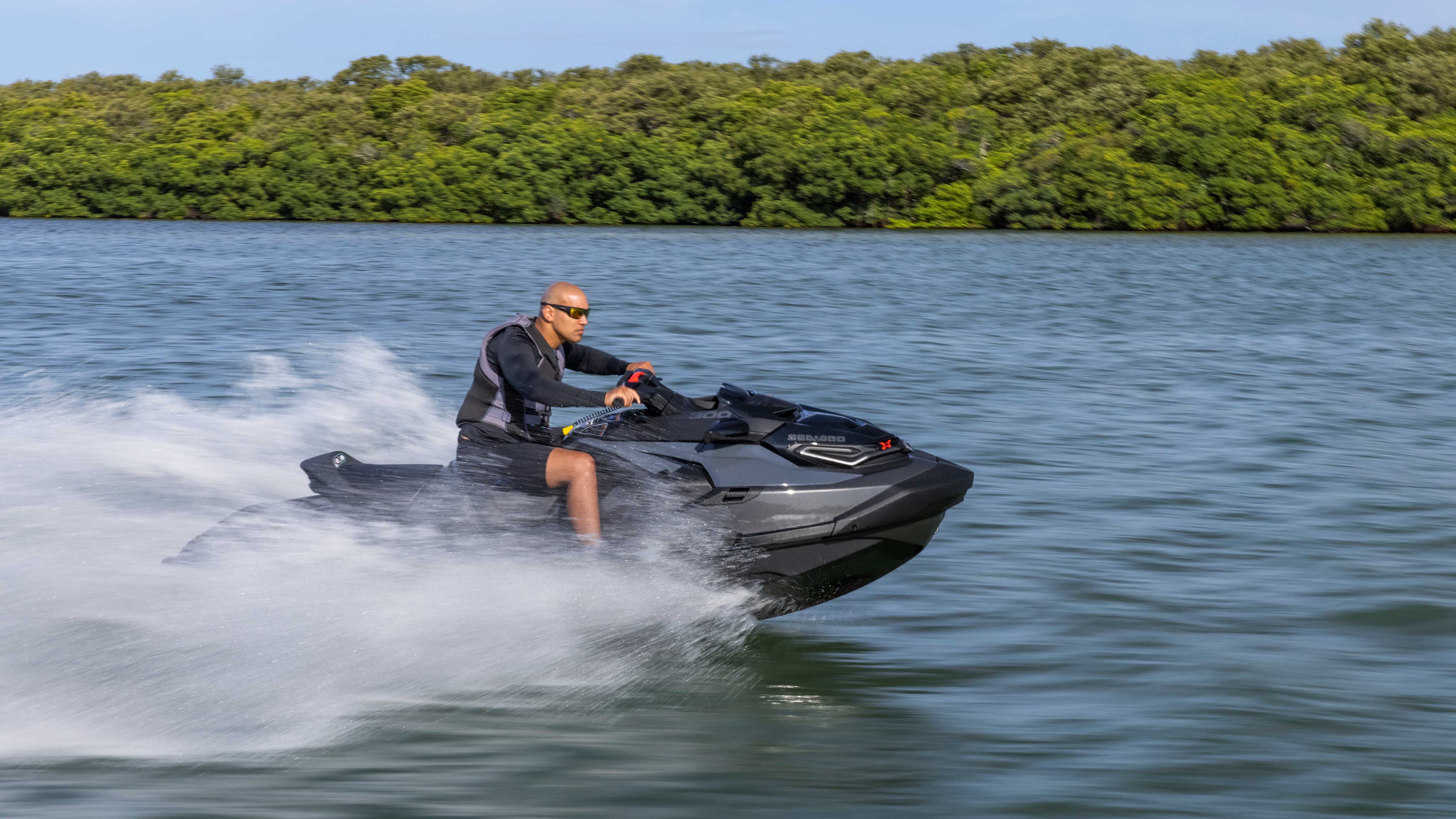 Man riding his black Sea-Doo RXP X