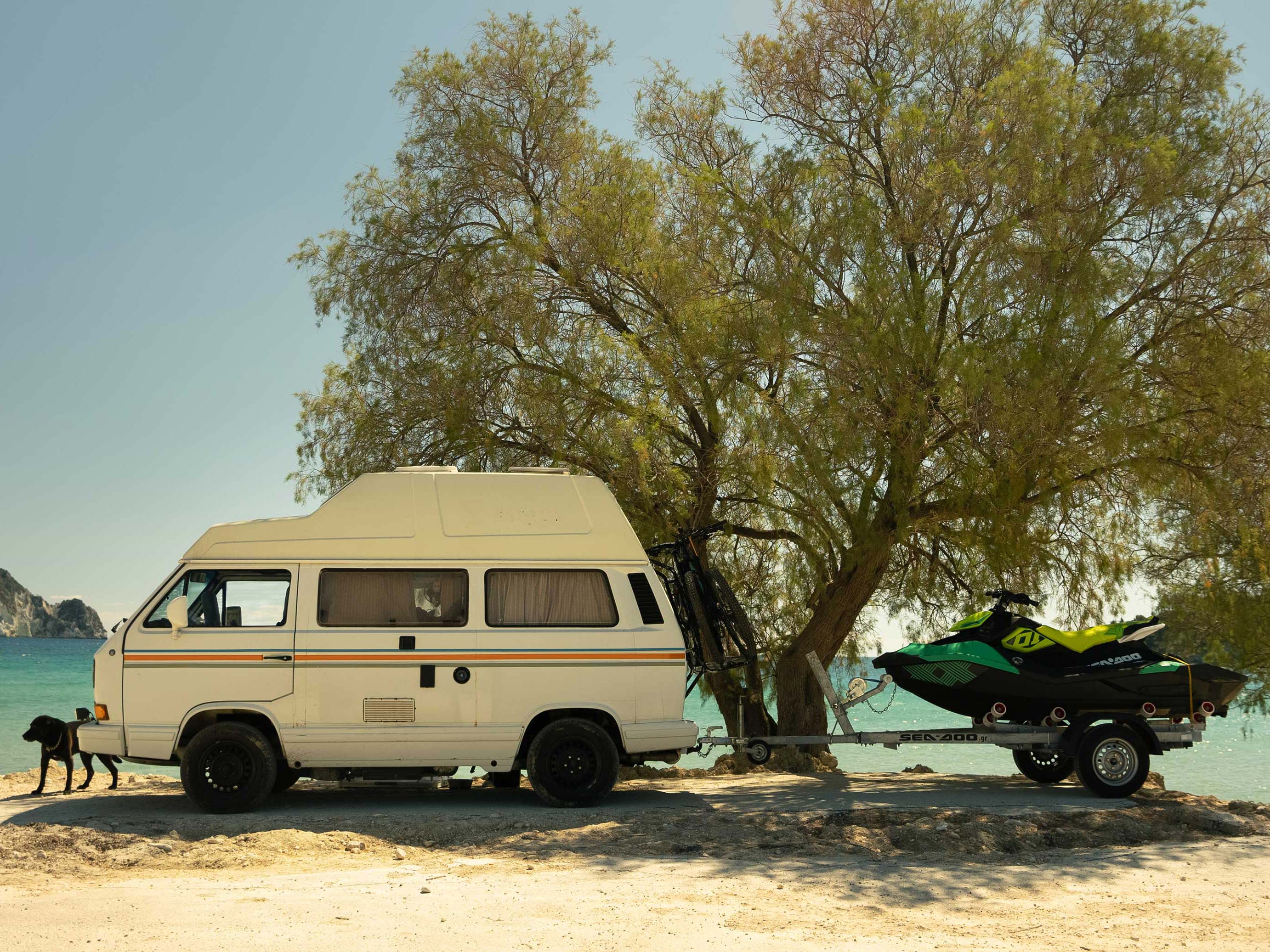 John and Eva's van with a Sea-Doo next to a beach