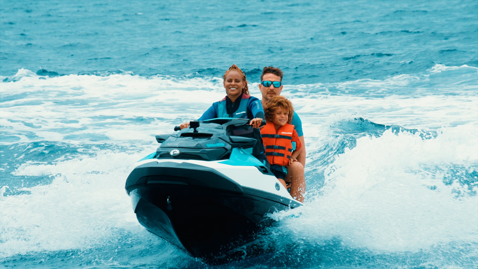 Family riding a Sea-Doo Personal Watercraft