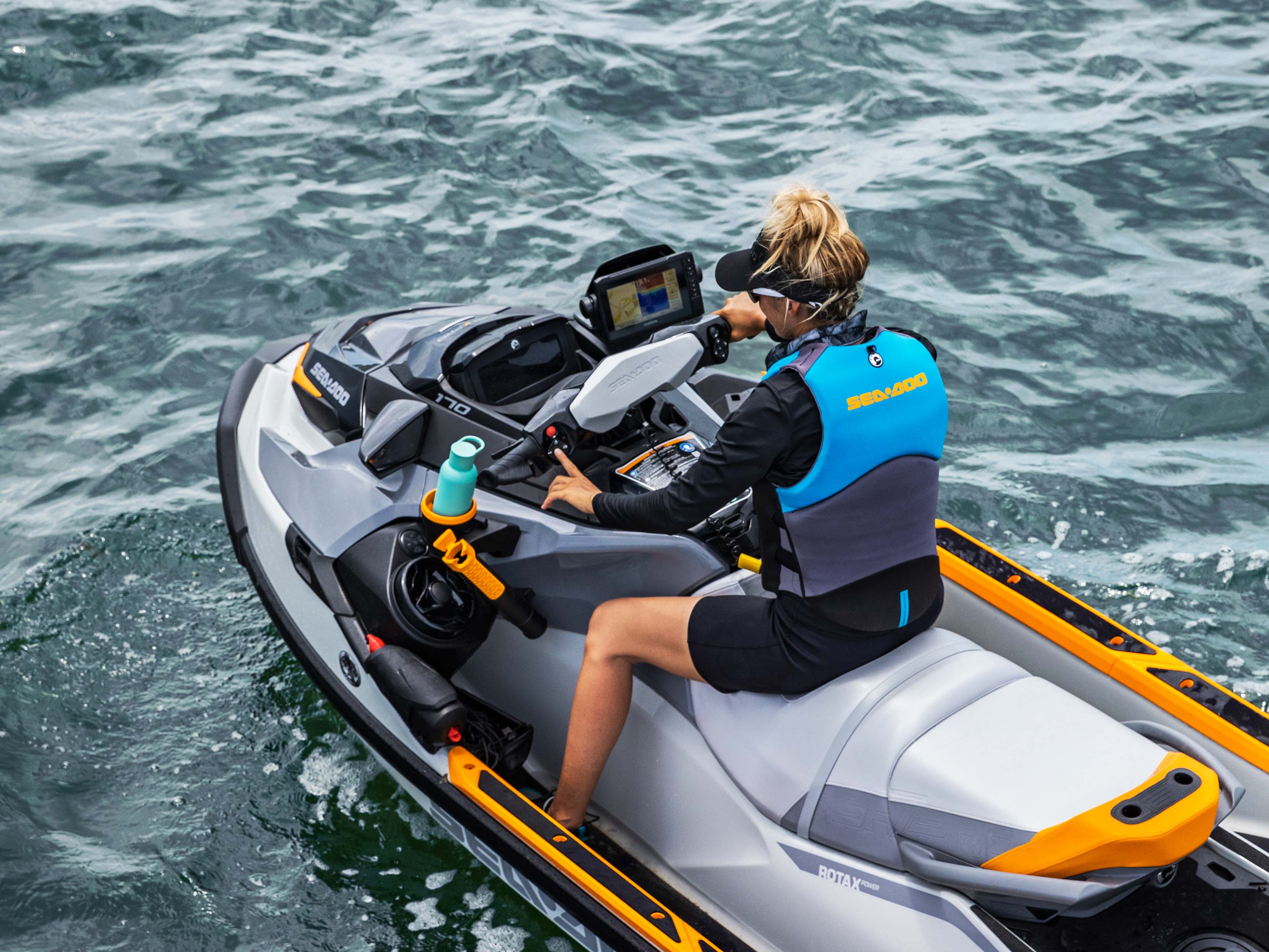 Woman driving the FishPro Trophy with Tech package