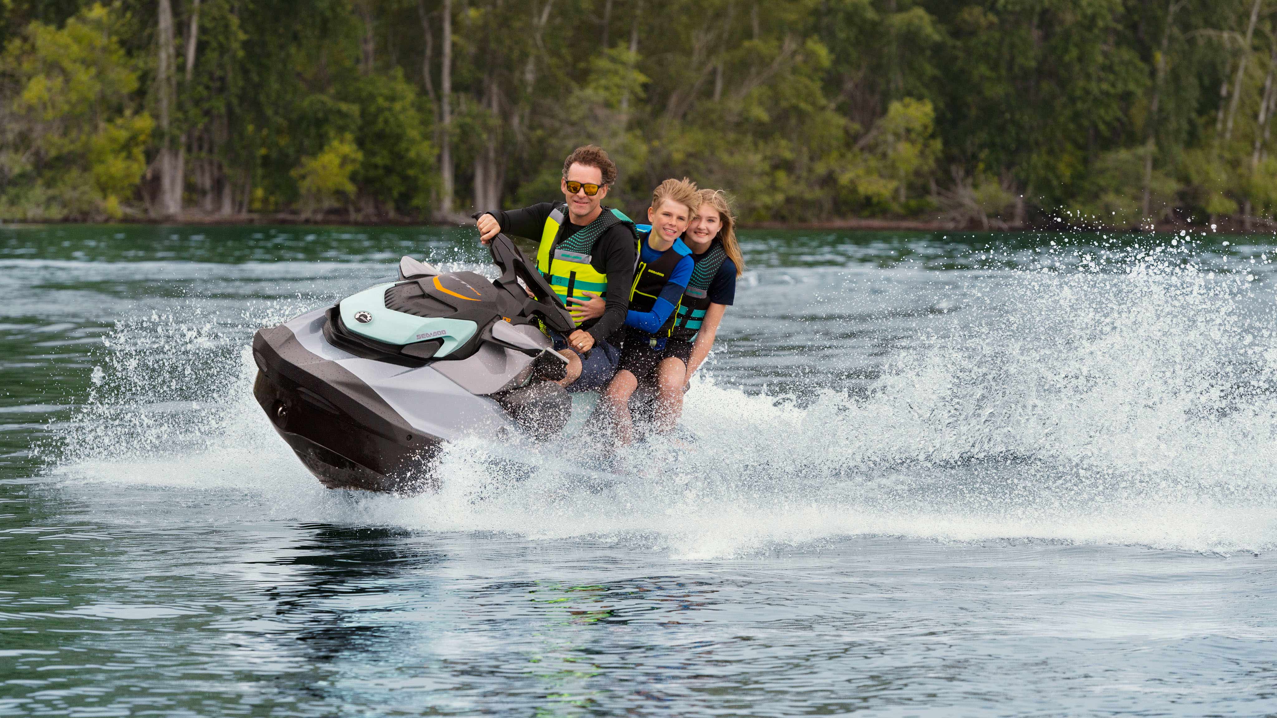 Dad and his two kids on the Sea-Doo GTI SE