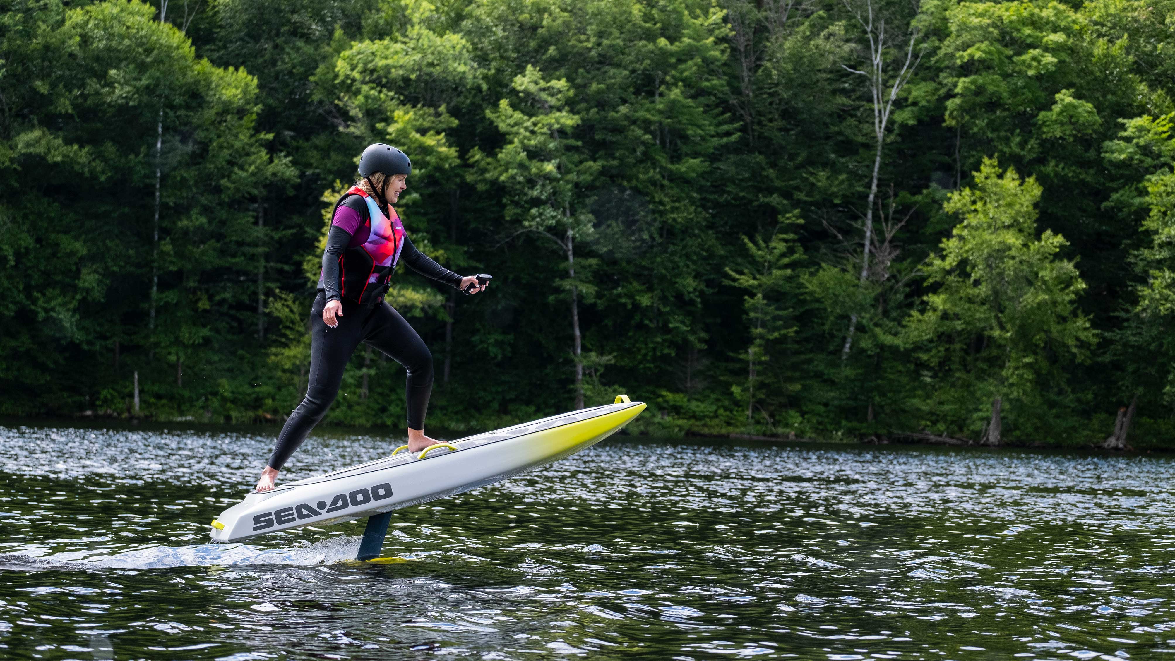 Woman surfing with the new Sea-Doo Rise