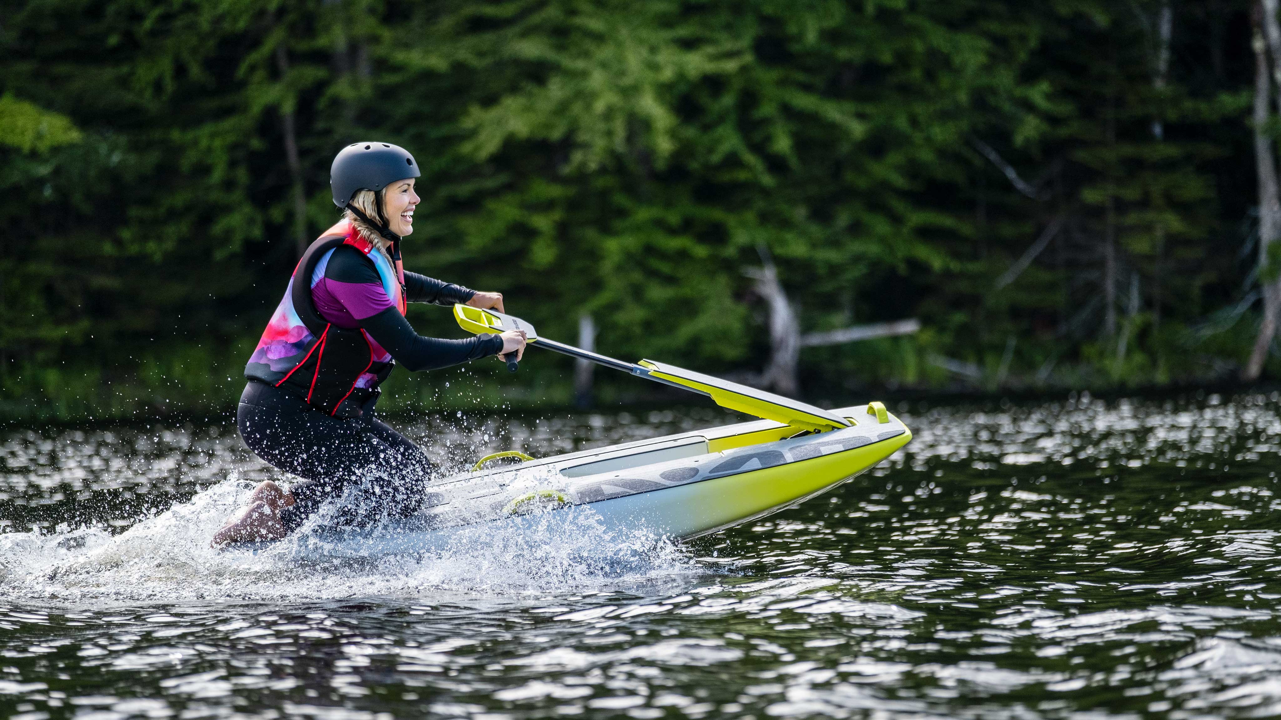 Woman surfing on her kneew with the new Sea-Doo electric hydrofoil board