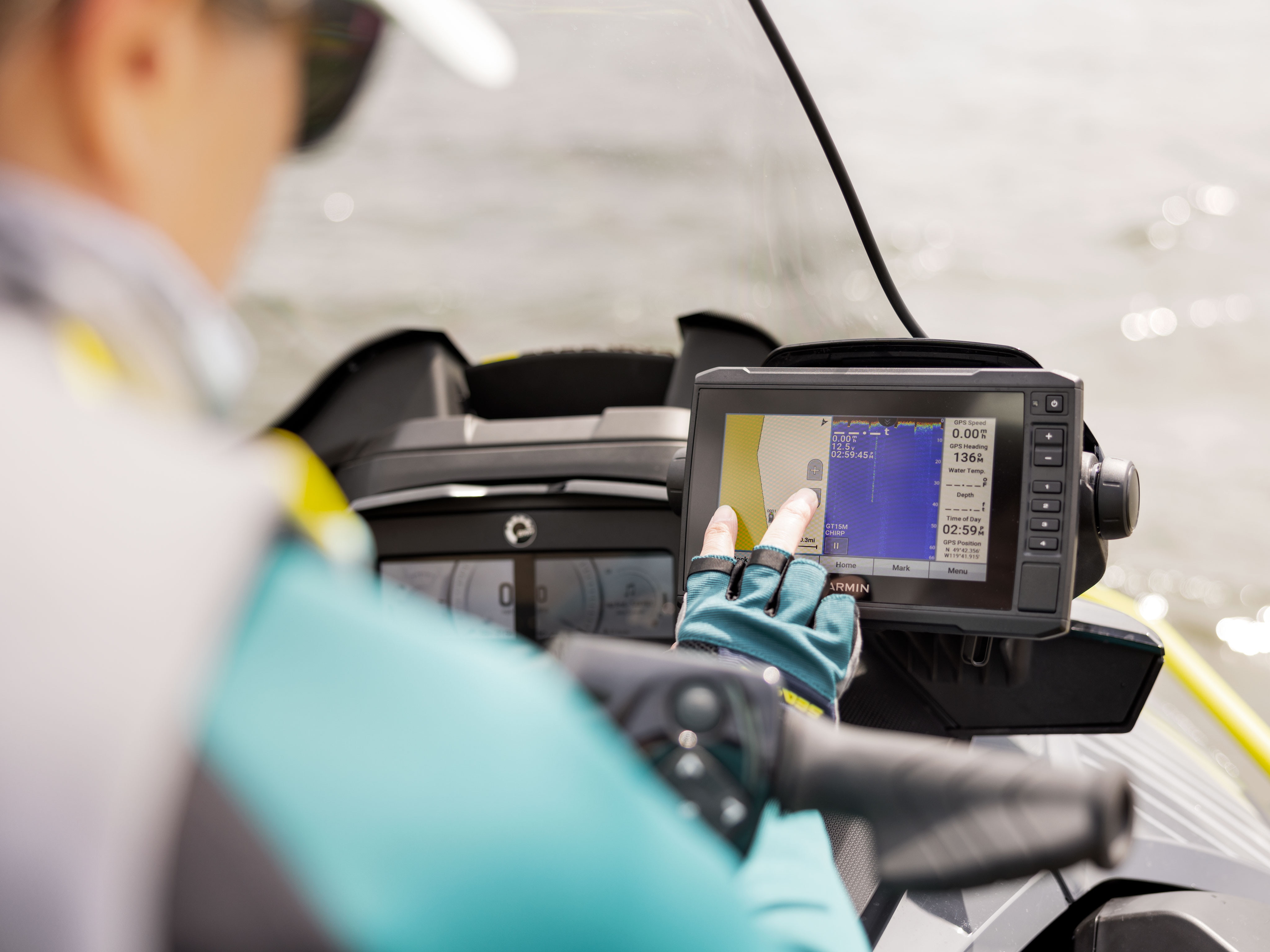 Woman using the Garmin 7'' Touchscreen Fish Finder & GPS