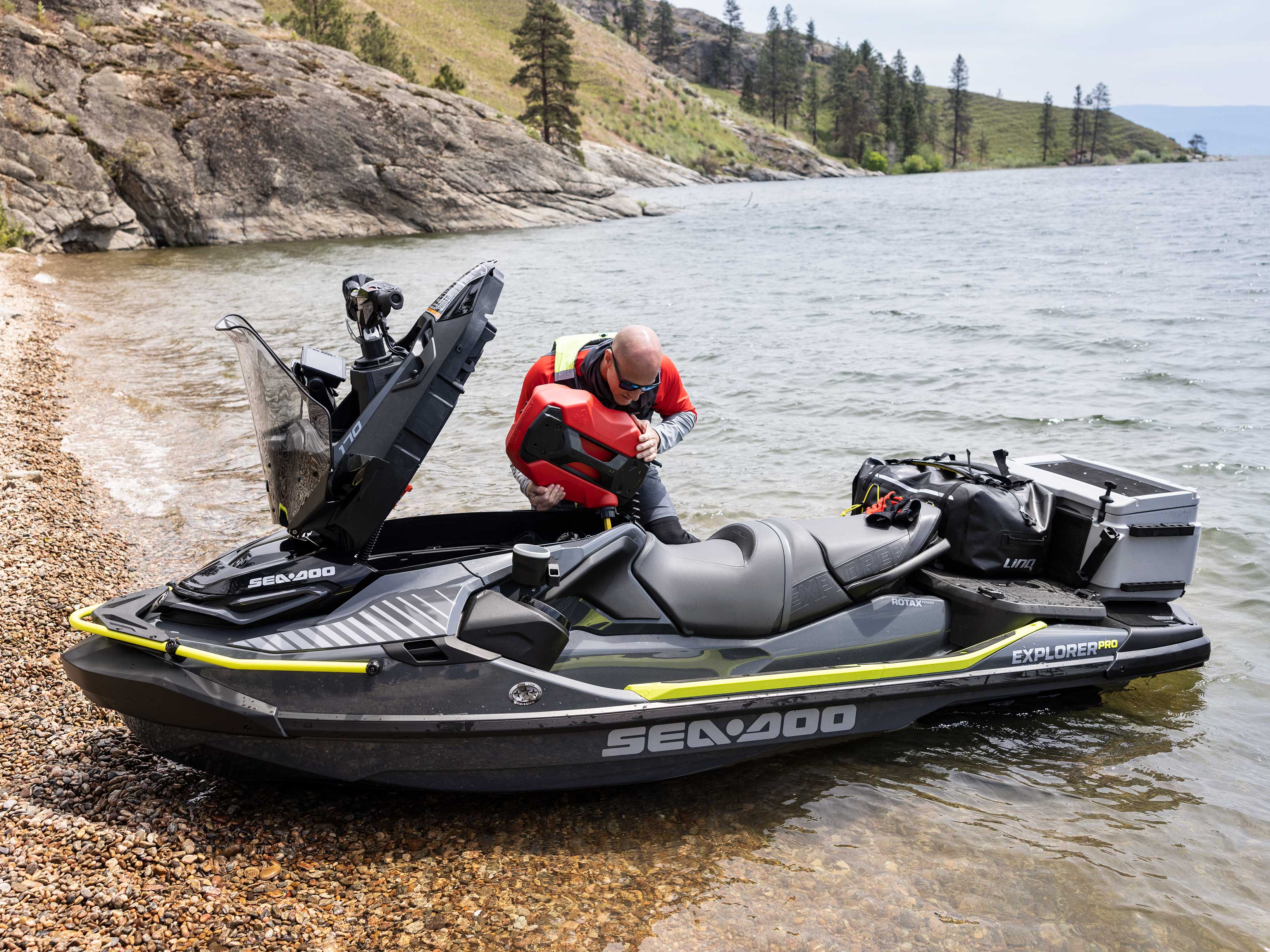 Man taking a fuel caddy from the front storage of the Explorer Pro