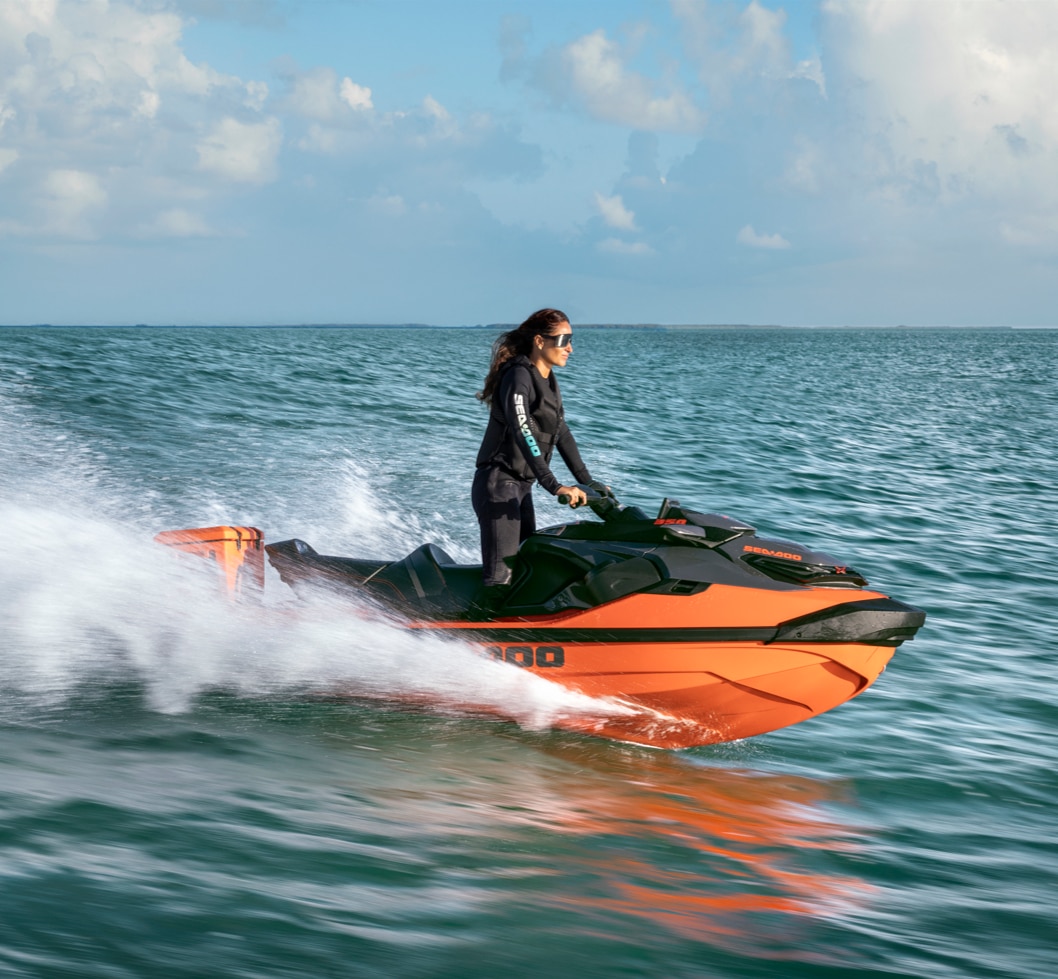 Woman riding a 2027 Sea-Doo RXT-X standing up