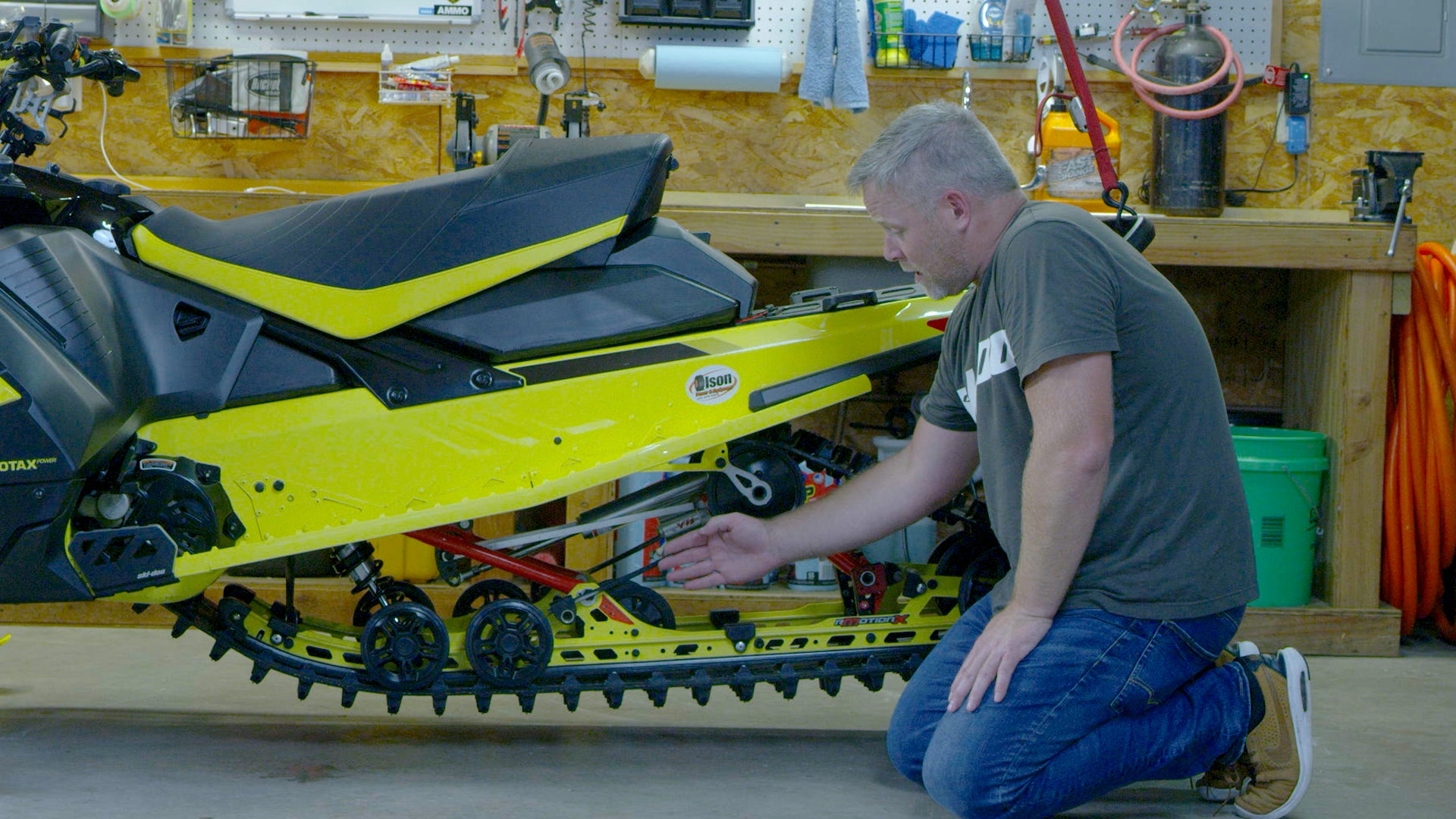 Troy Oleson maintaining his trail snowmobile