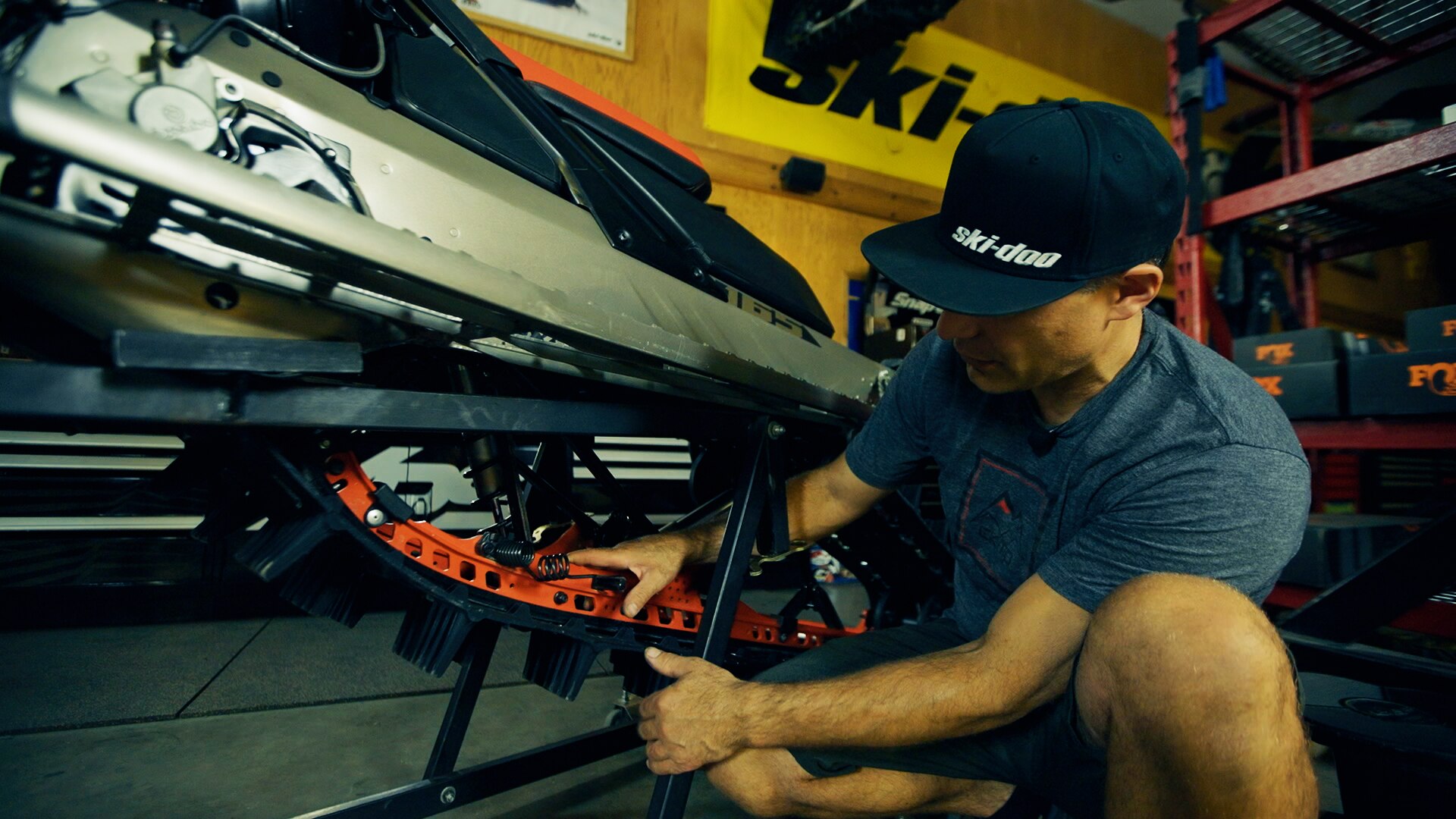 Ski-Doo Ambassador Carl Kuster working on his snowmobile