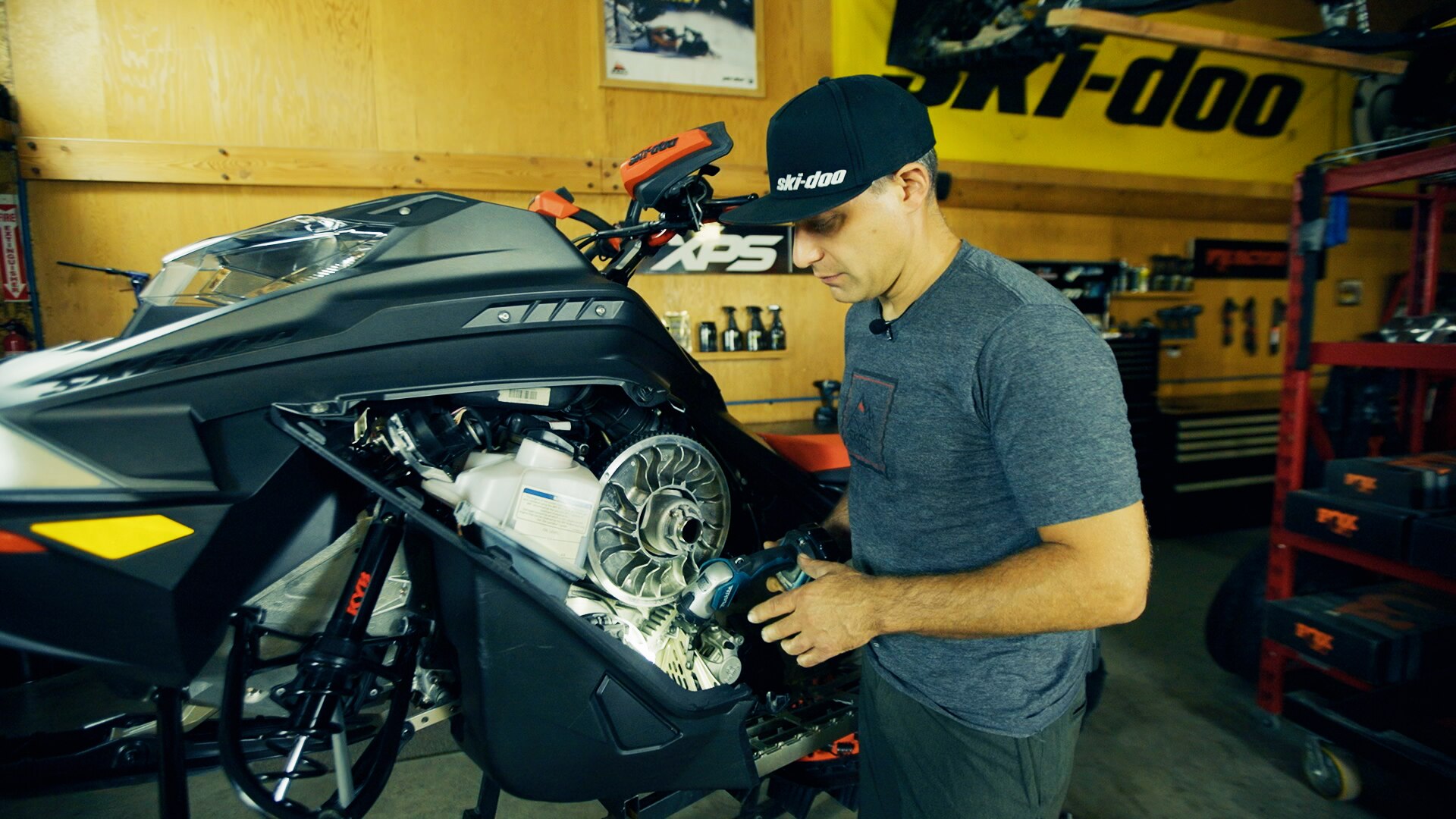 Ski-Doo Ambassador Carl Kuster working on his Ski-Doo snowmobile