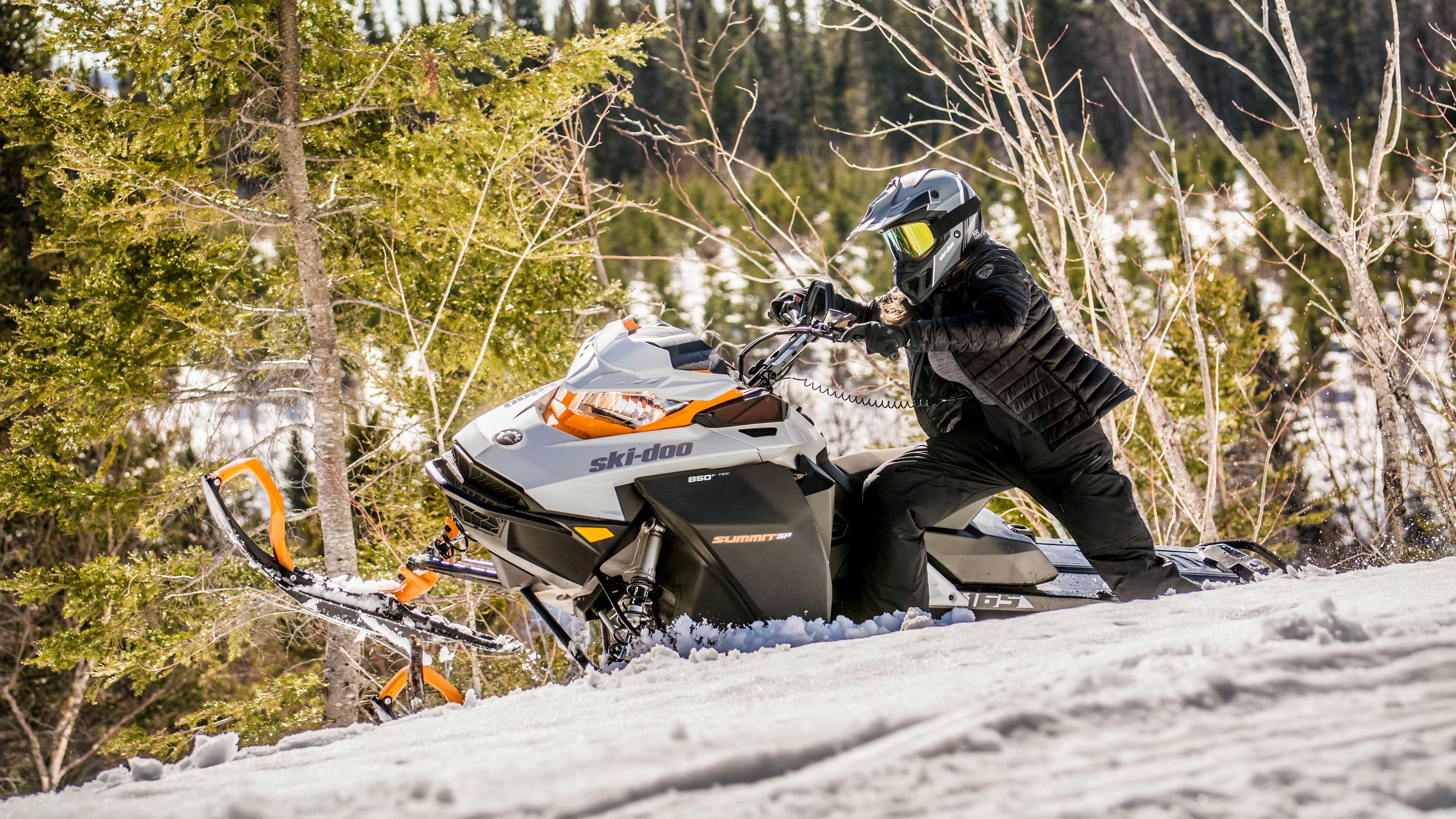 Woman riding a Ski-Doo Summit