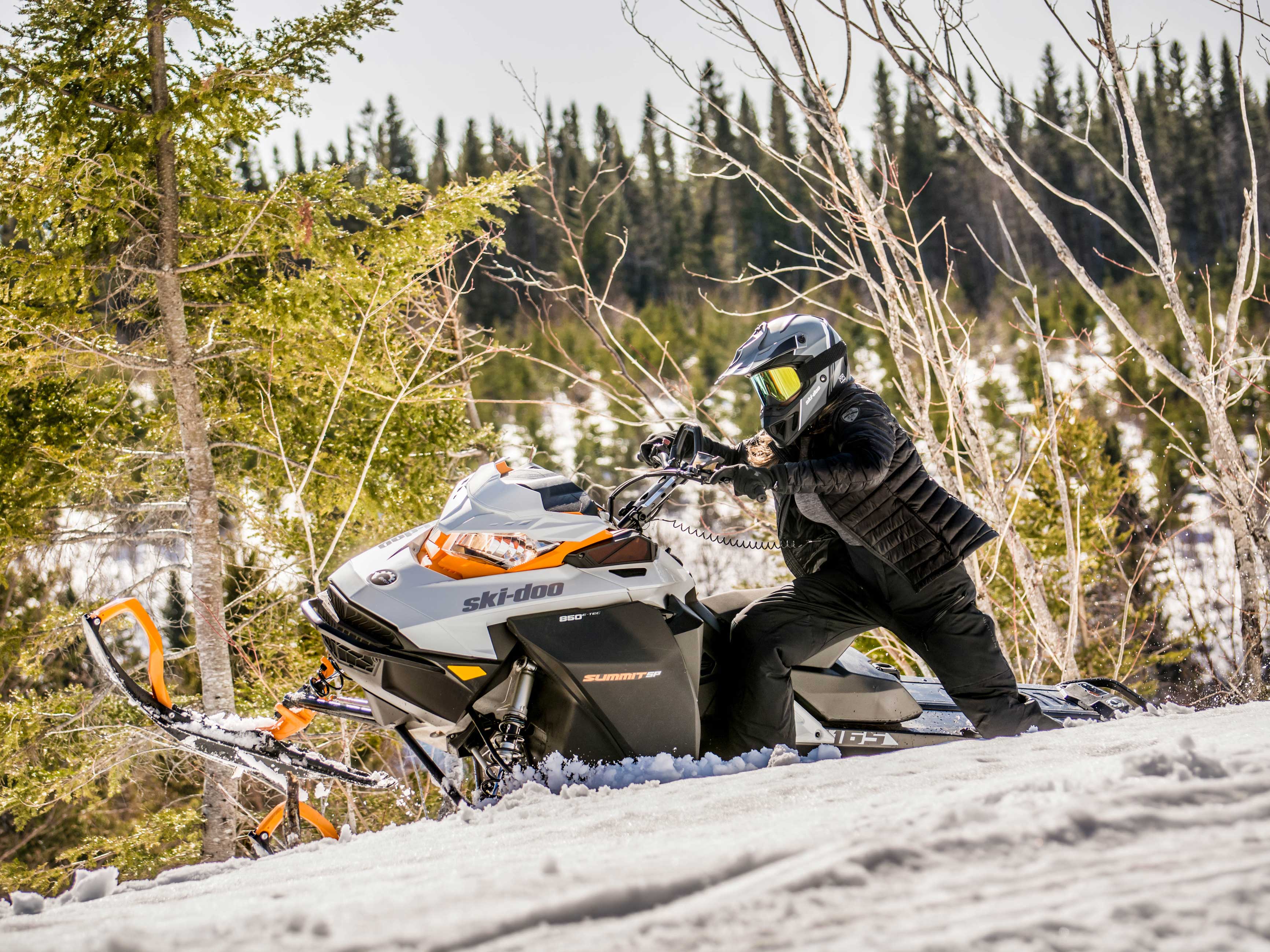 Woman riding a Ski-Doo Summit