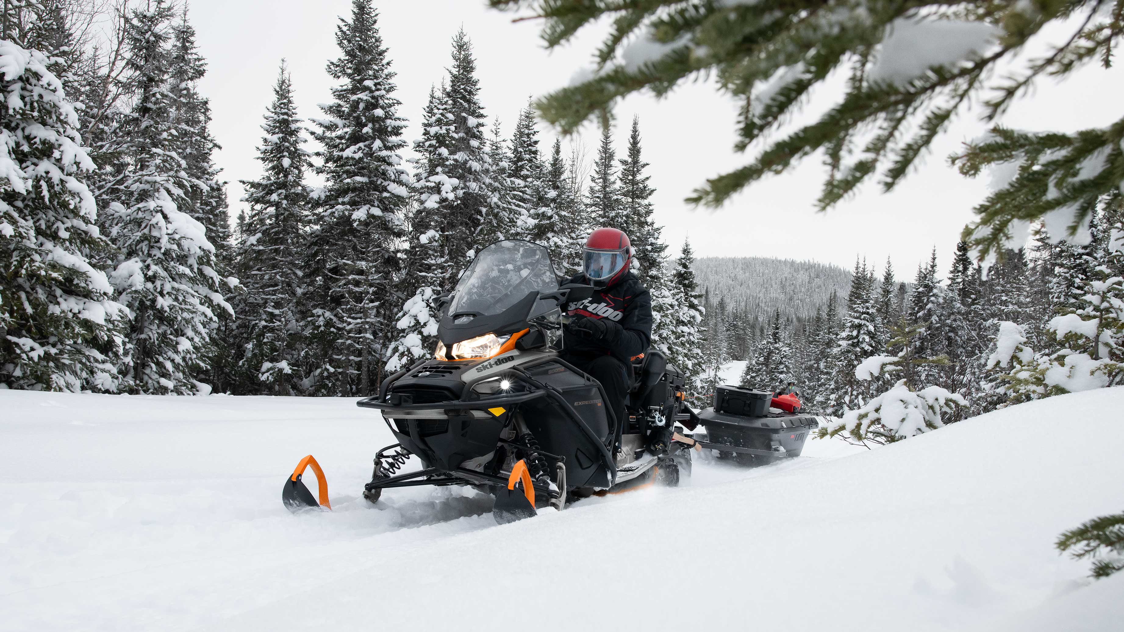 Man riding his Ski-Doo Expedition on a trail