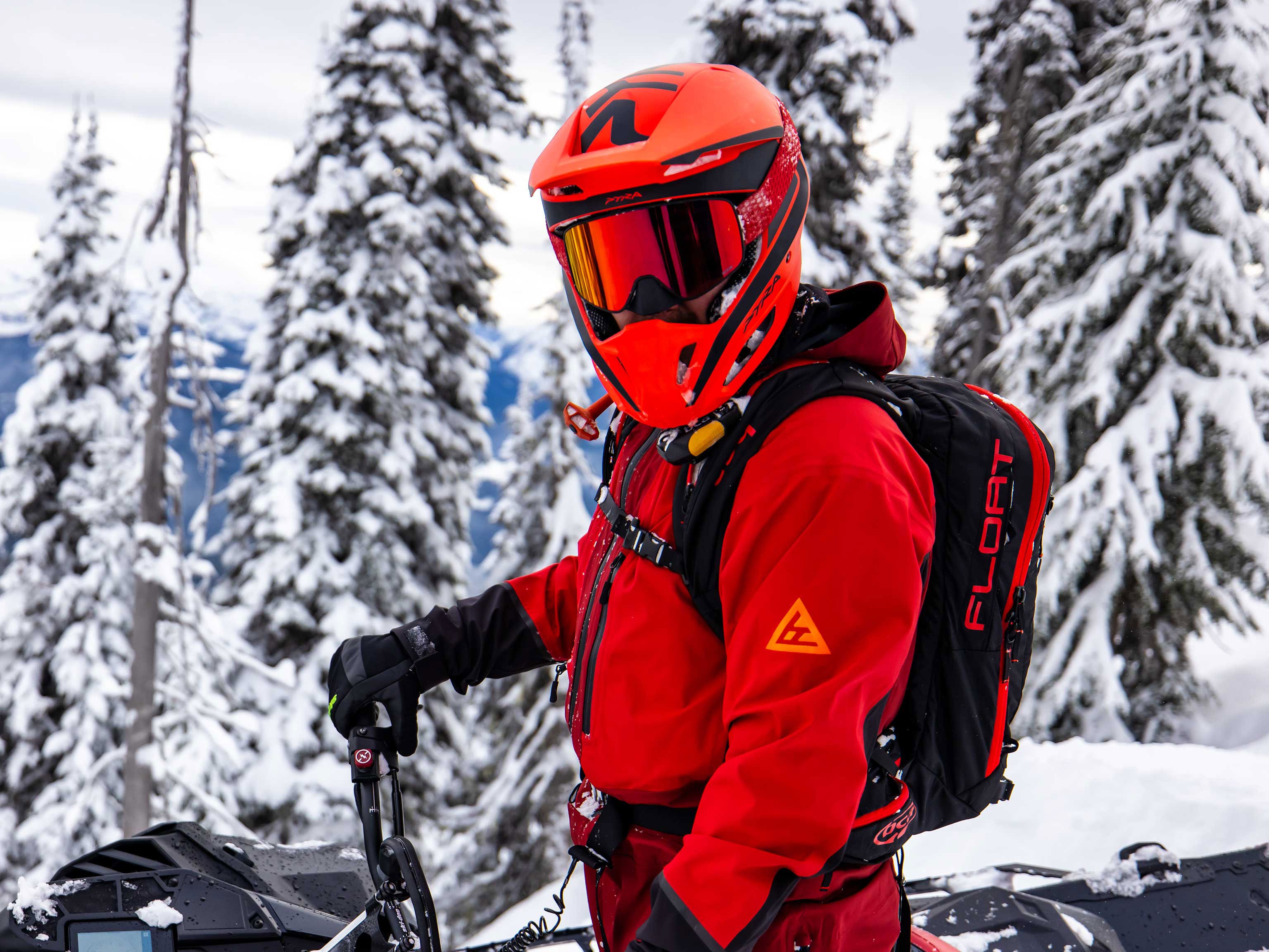 Man wearing Ski-Doo accessories and gear