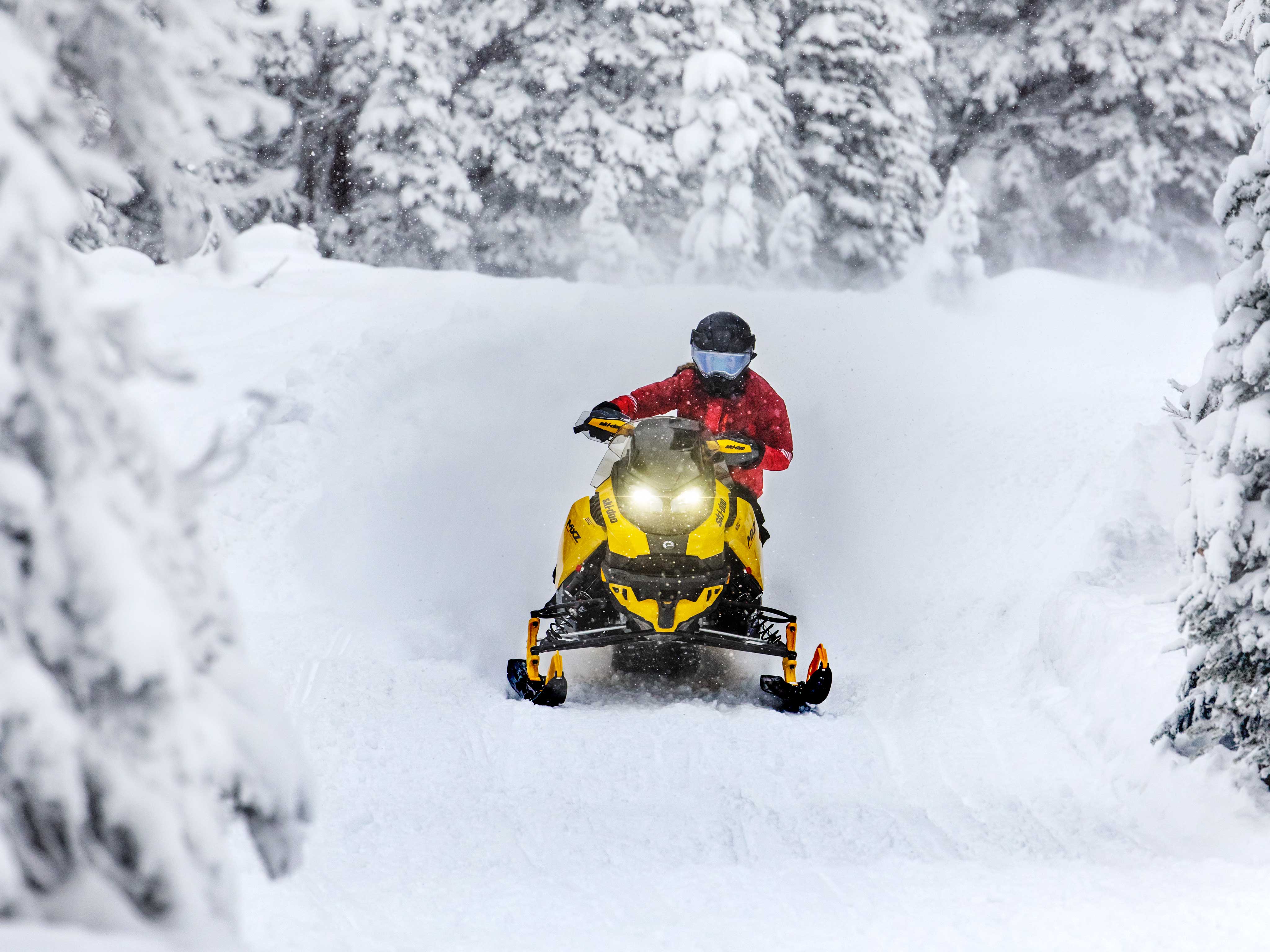 Woman cornering with a Ski-Doo MXZ Blizzard